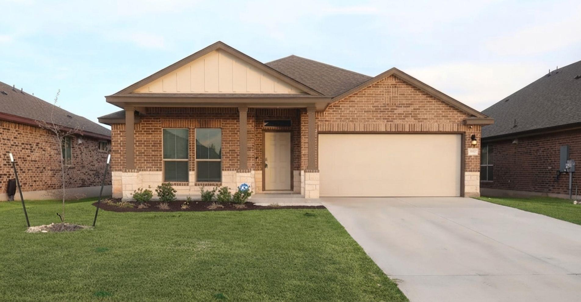 Brick veneer and stone accents adorn this charmin