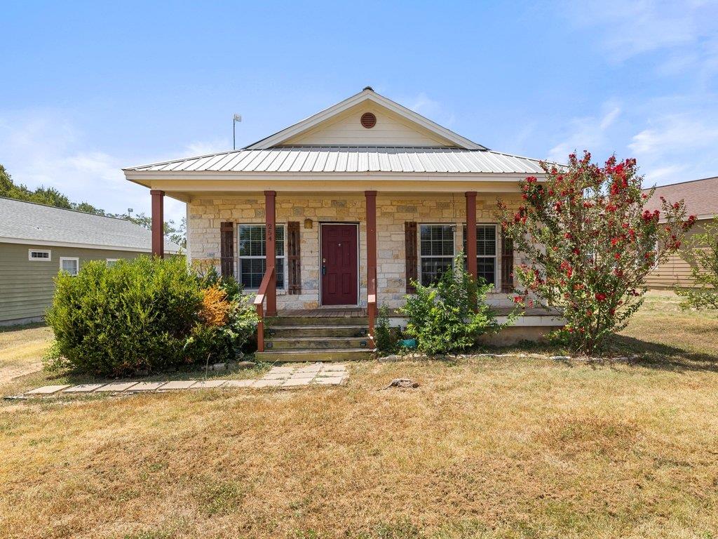 Stone masonry and a metal roof define this classi