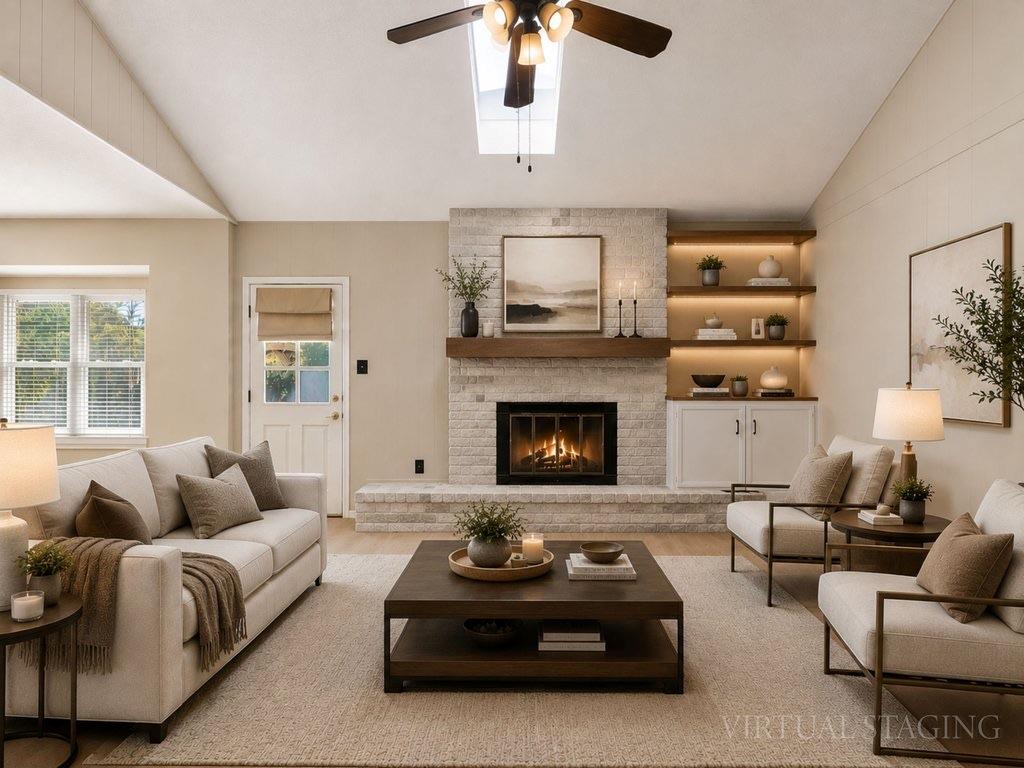 Vaulted ceilings and a stone fireplace define thi