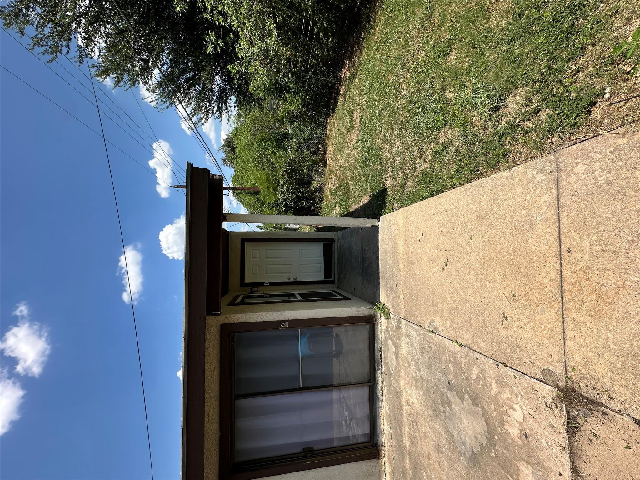 Concrete walkways lead to a covered private entry