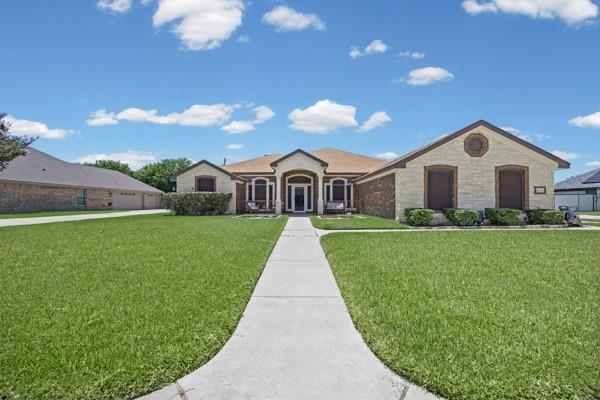 A graceful ranch-style home presents a welcoming 