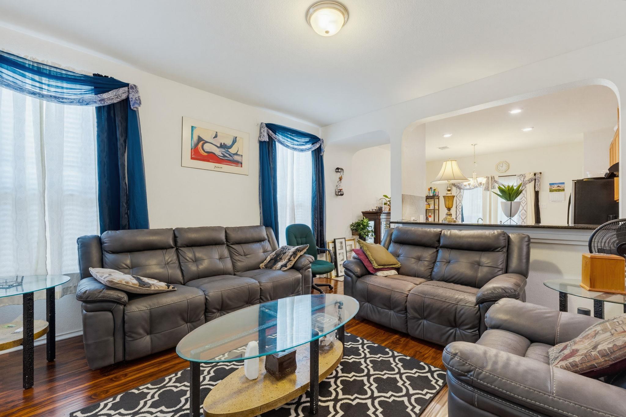 A comfortable living space featuring rich hardwoo