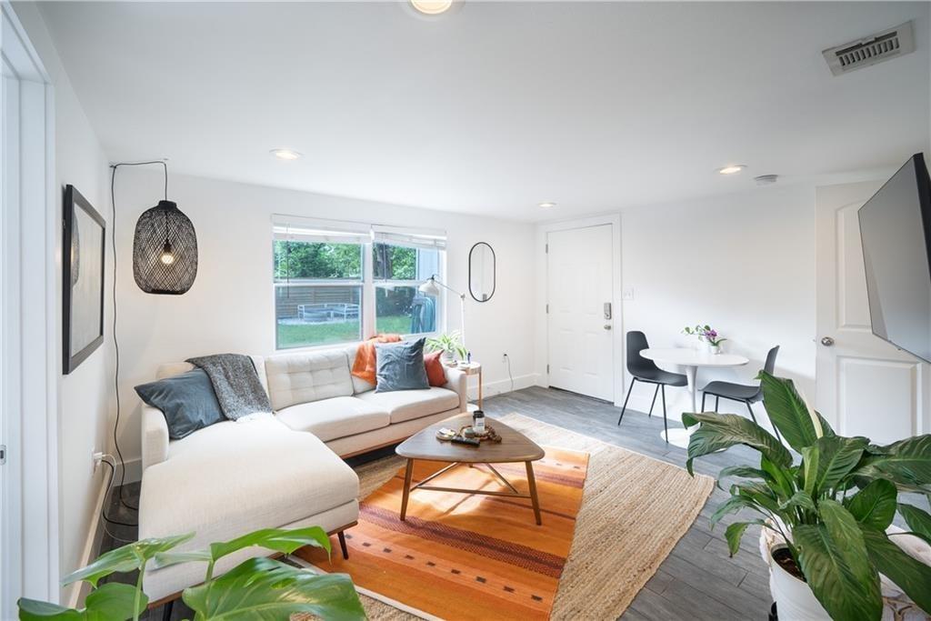 Living room with wood finished floors and recesse