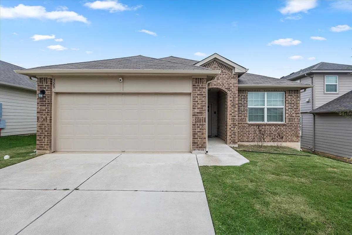 Brick facade with an inviting arched entry and an