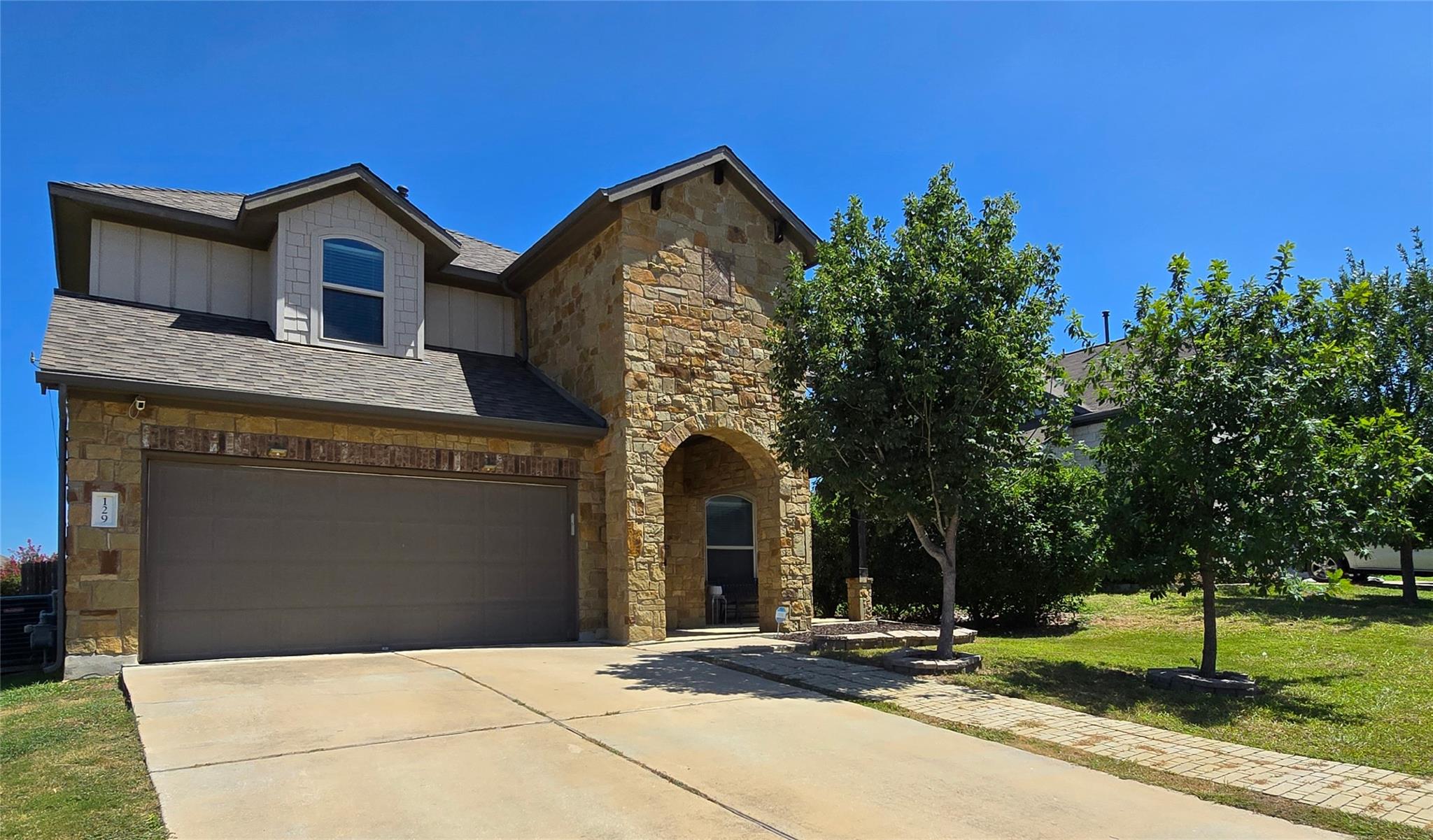 A striking stone facade and arched entry define t
