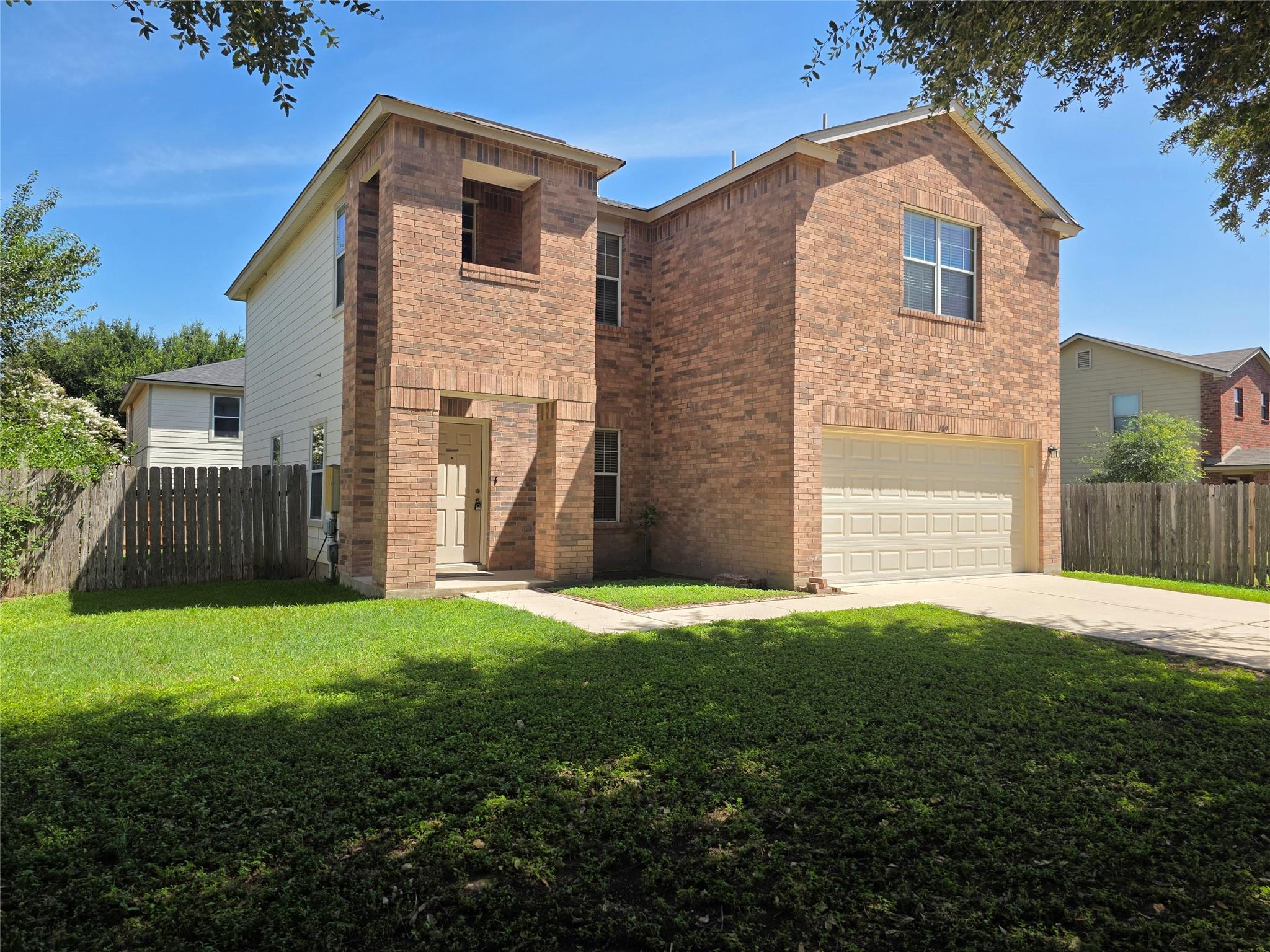 A classic brick and siding two-story home offers 
