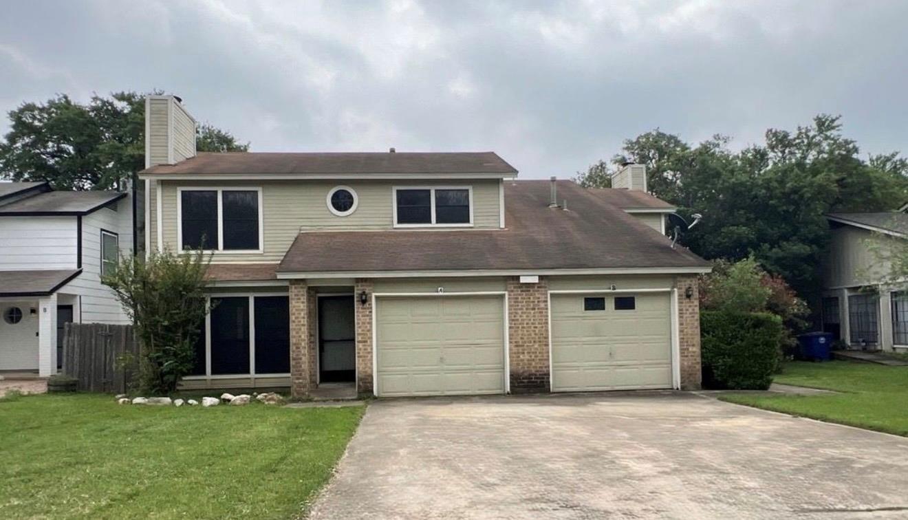 A classic two-story residence with an attached do