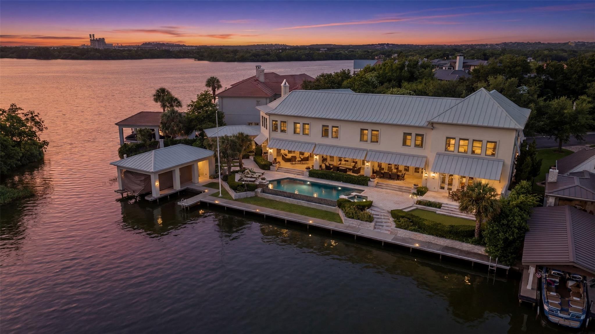 An exquisite waterfront estate offers a private p