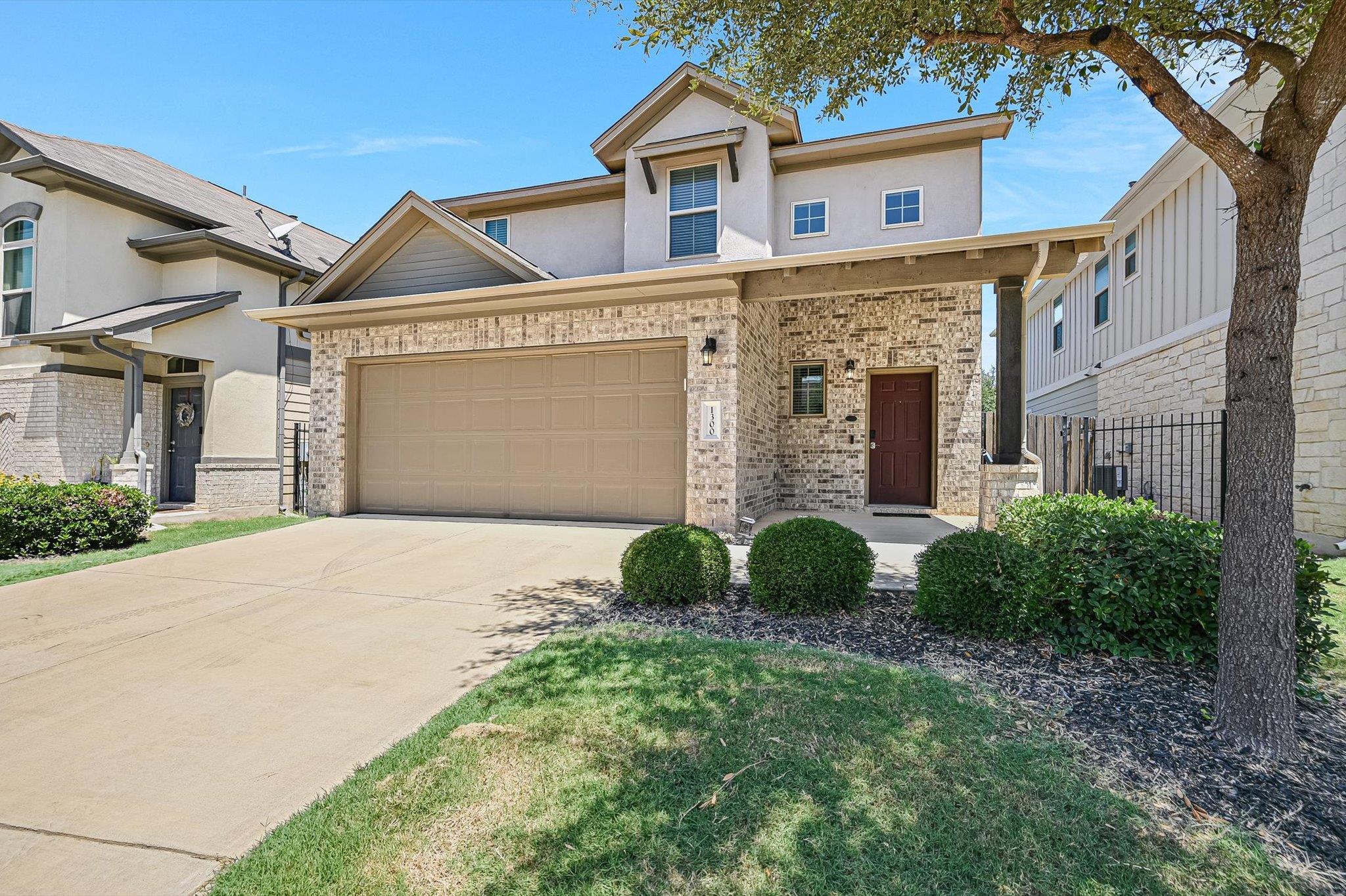 A welcoming brick and stucco facade greets you wi
