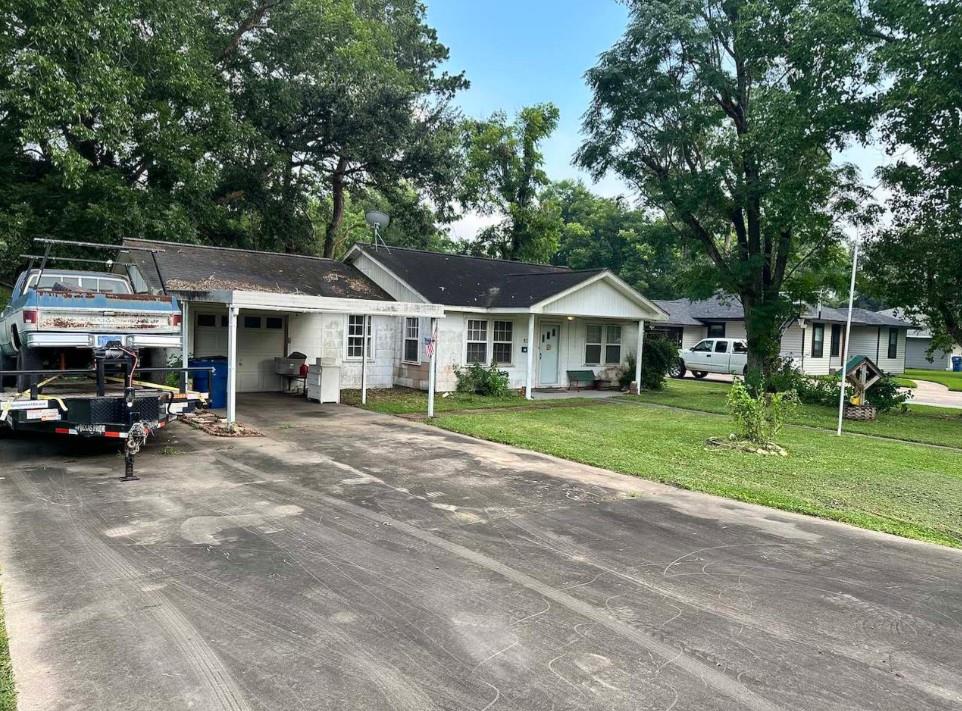 A classic ranch home nestled among mature trees w