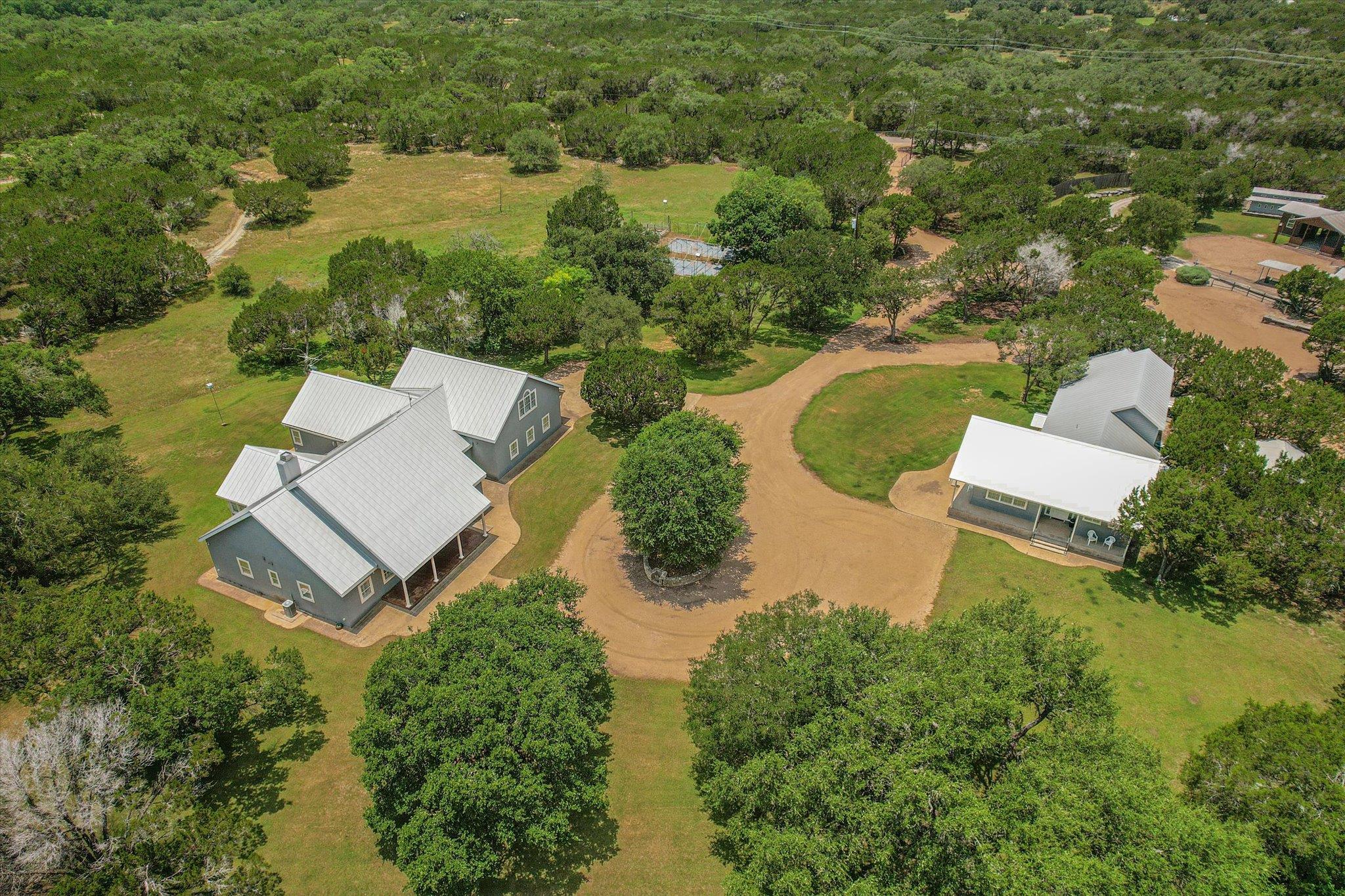 Mature trees surround this expansive property fea