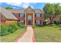 Grand brick residence with stately columns and a 