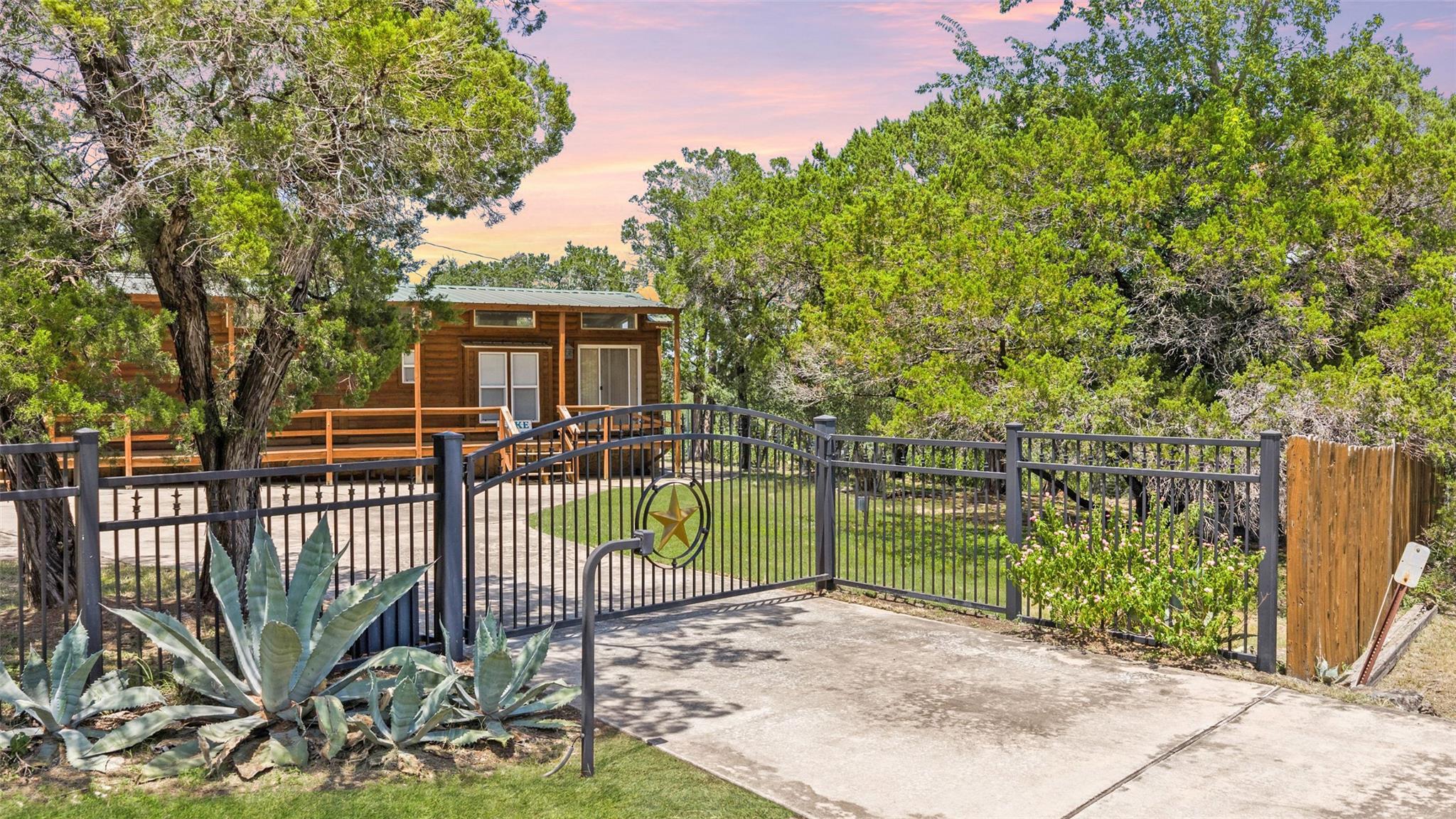 Securely gated entry welcomes you to a charming w