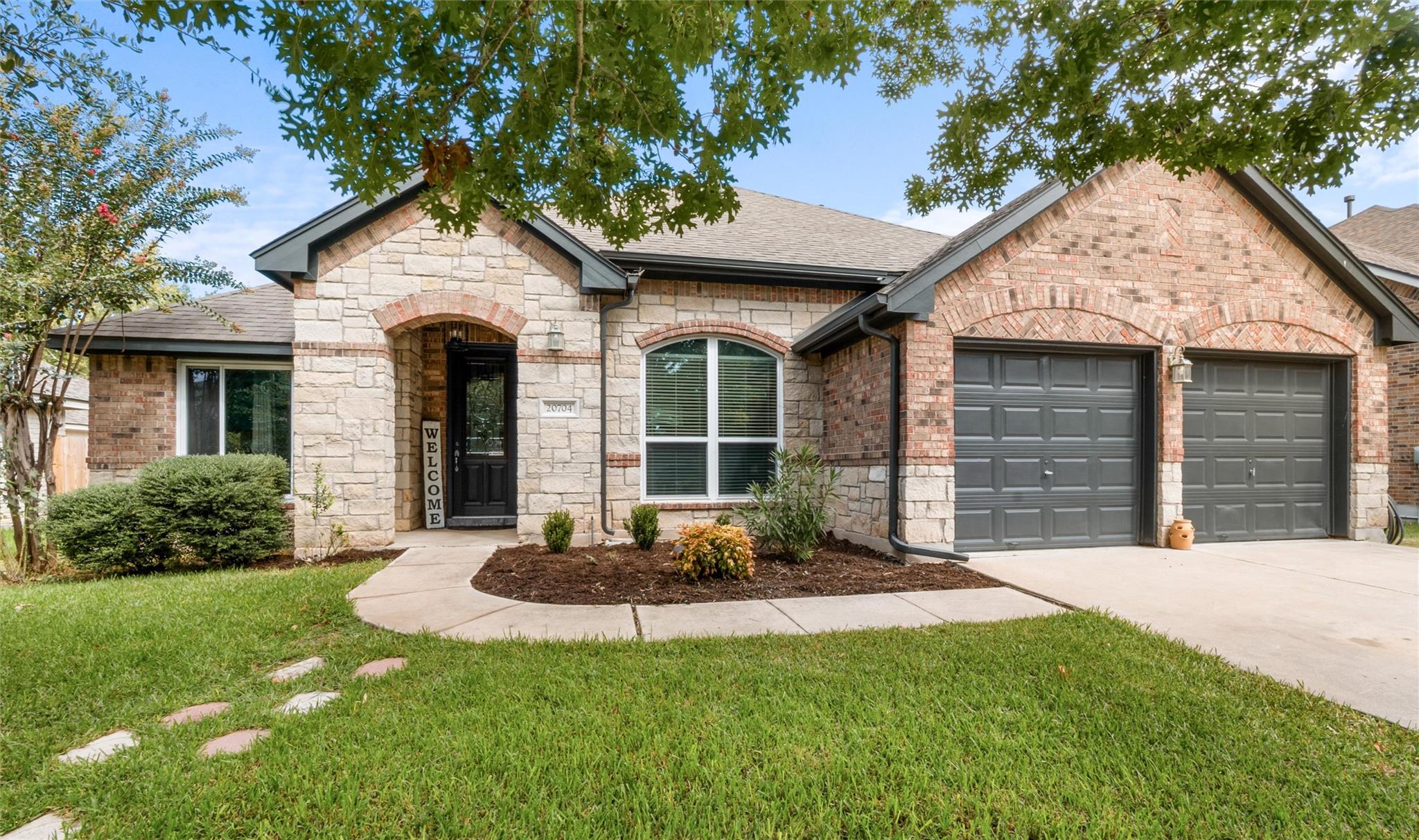 A charming blend of brick and stone masonry defin