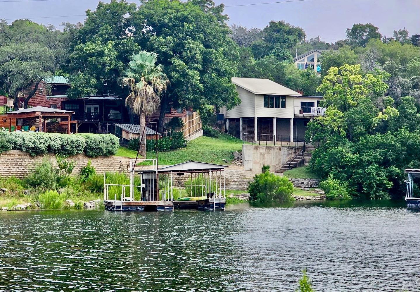 Lush green hills surround this peaceful waterfron