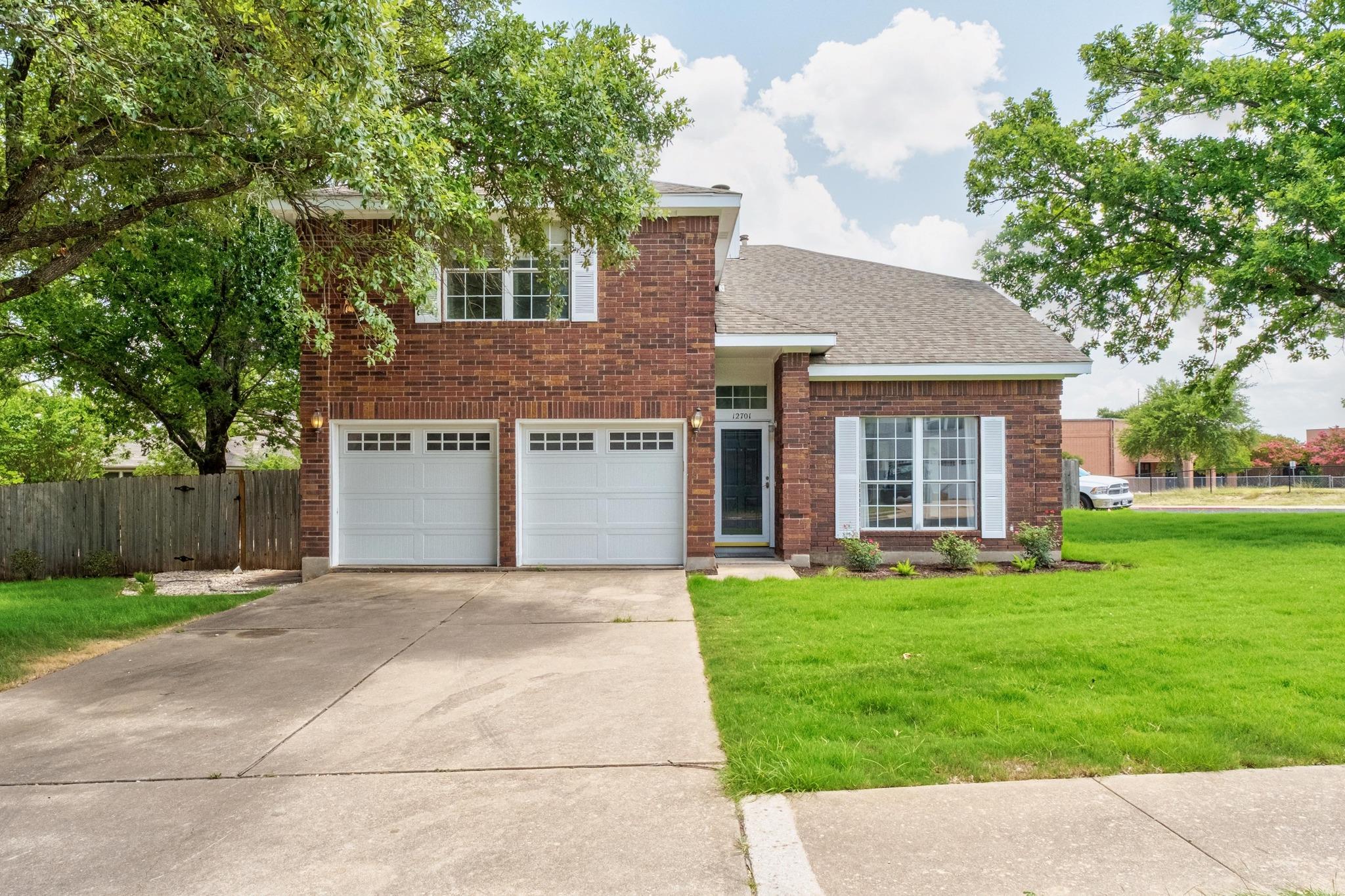 A well-maintained brick exterior with an attached