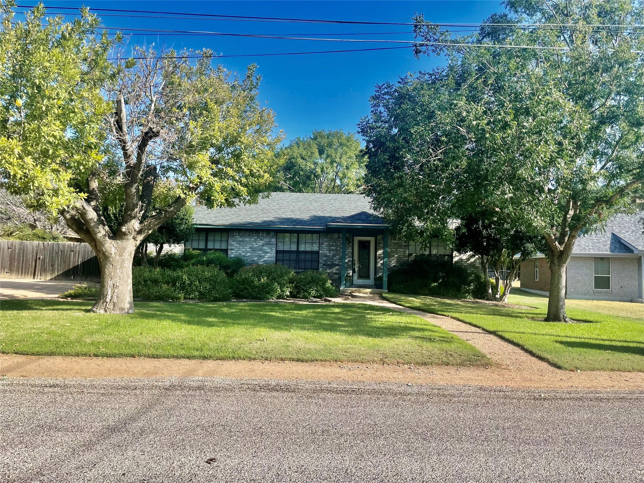 View of front of house featuring brick siding and