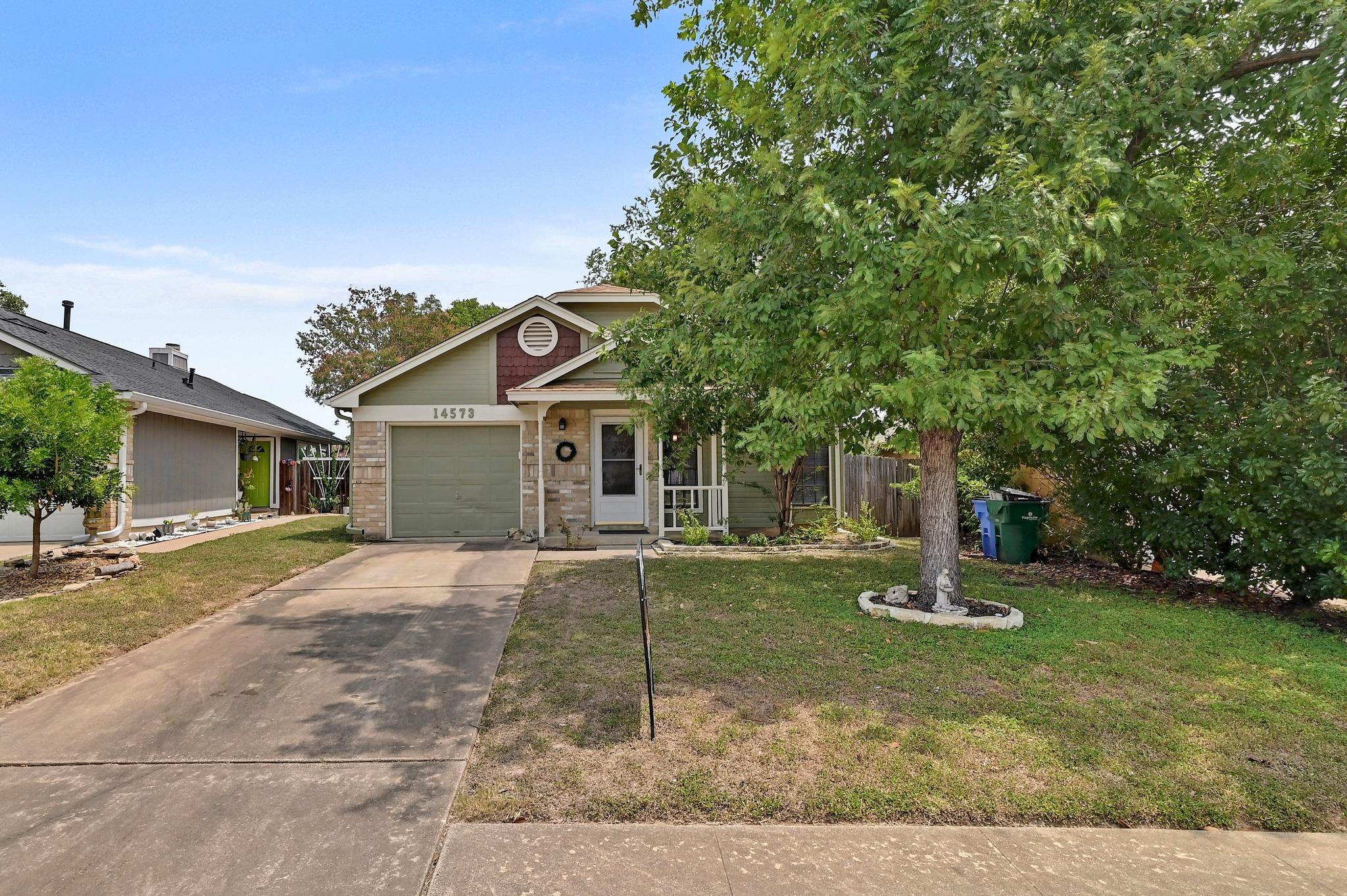 An inviting front facade with a welcoming porch a