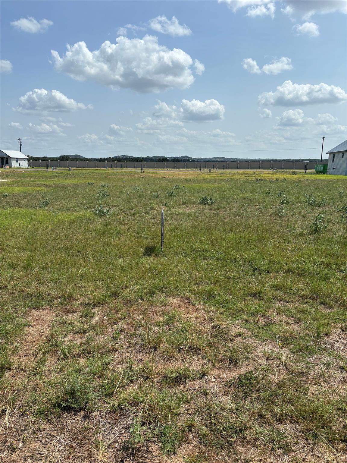 A generous undeveloped land plot awaits future co