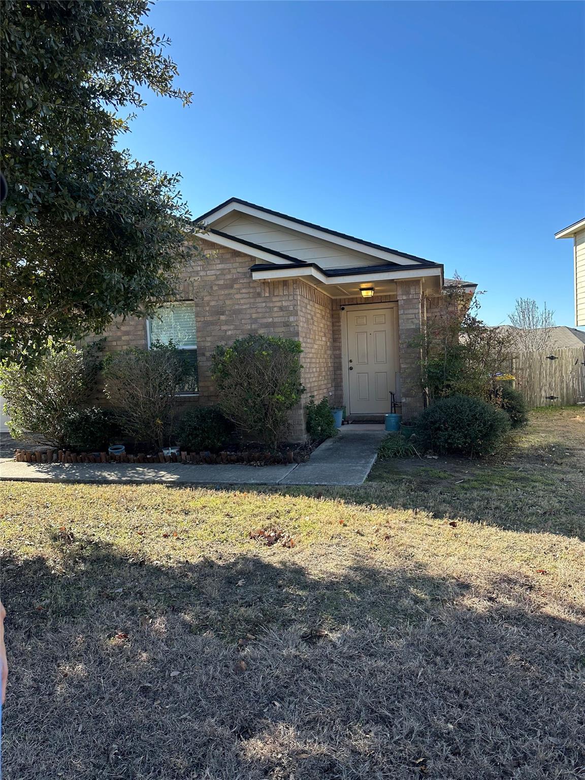 A classic brick exterior with a welcoming entrywa