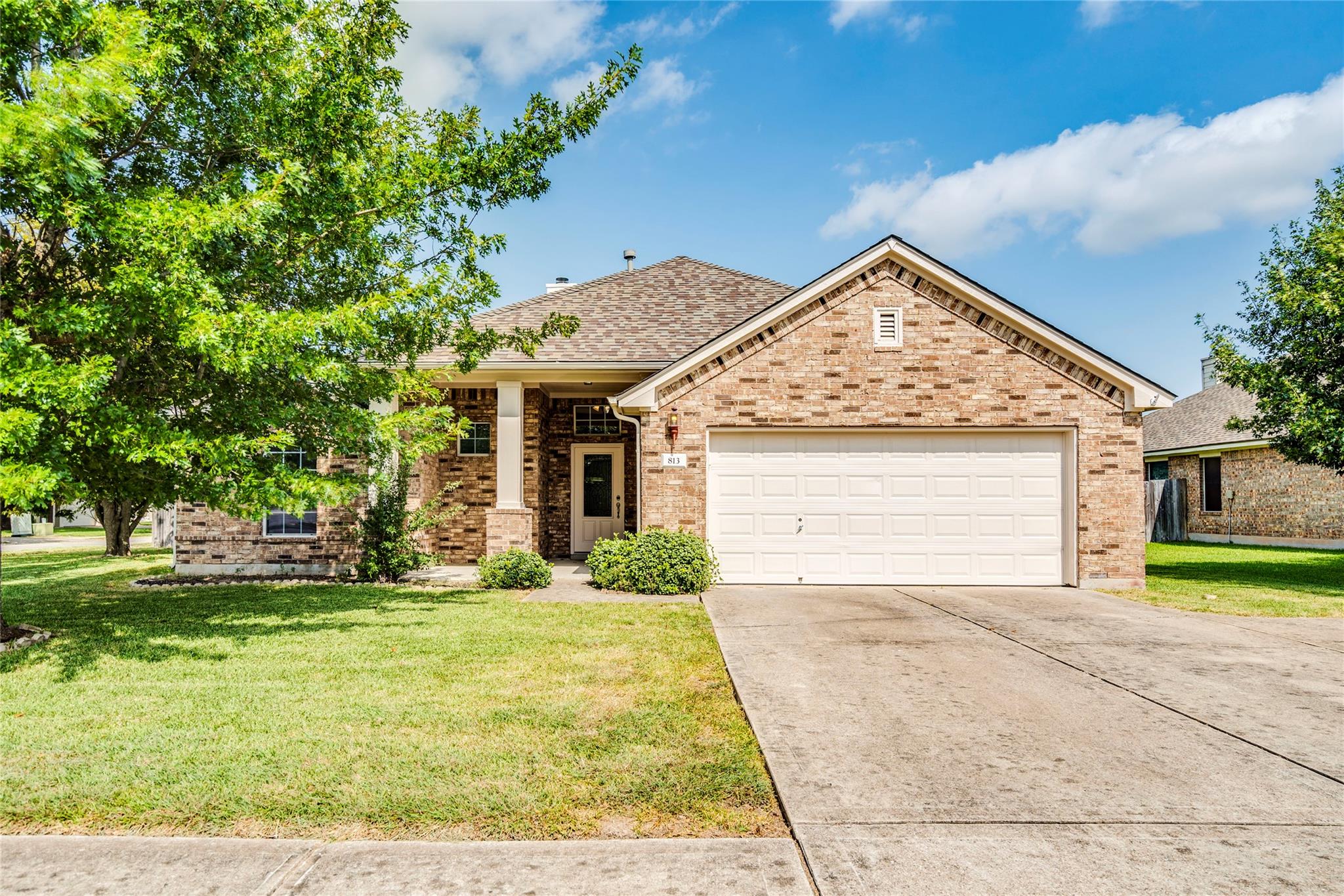 A classic brick exterior with a welcoming porch a