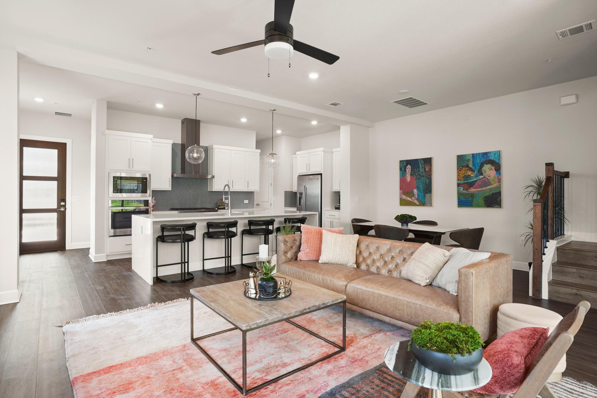 An open concept living area boasts rich hardwood 