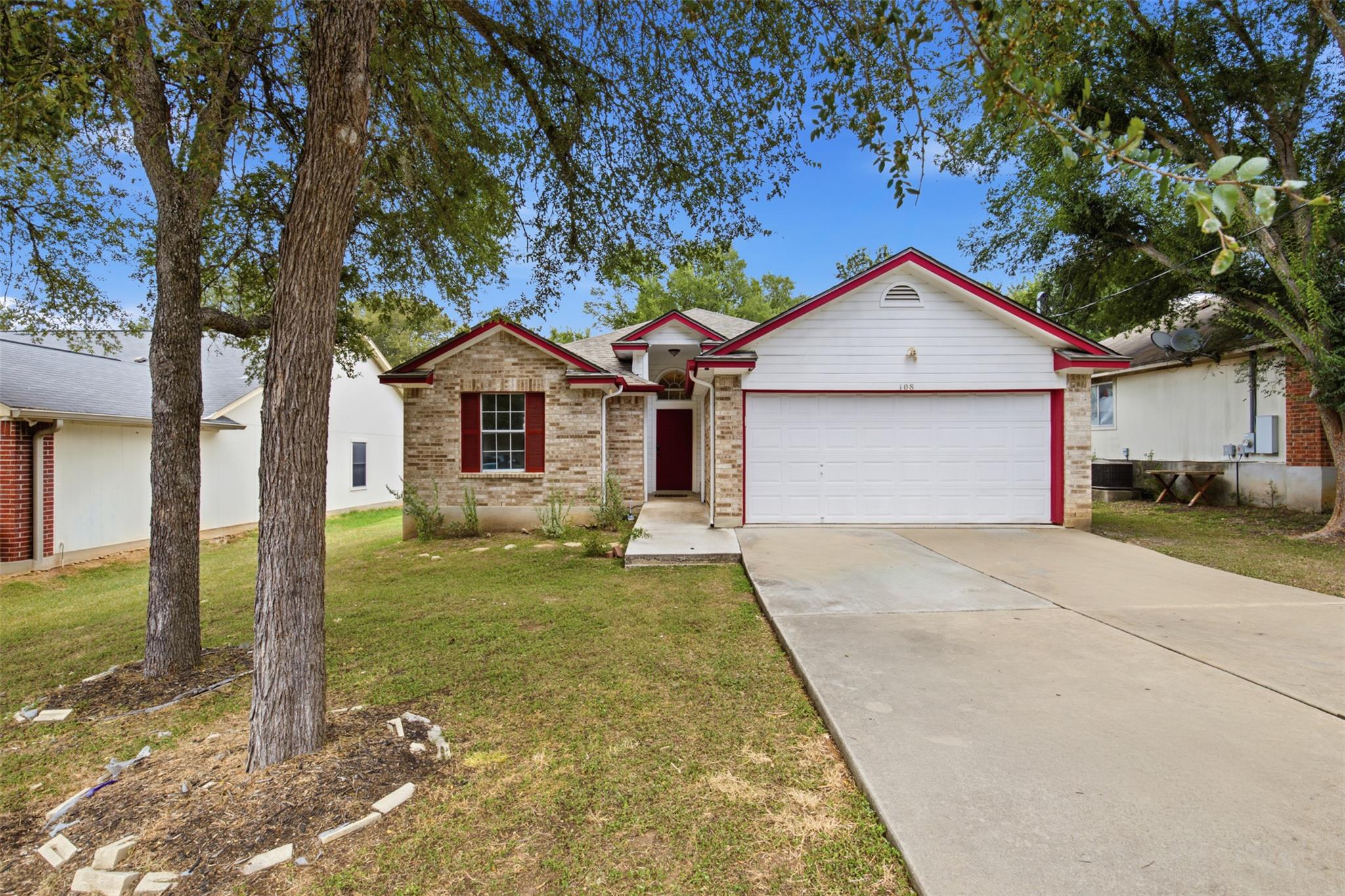 A welcoming brick and siding home with a bright r