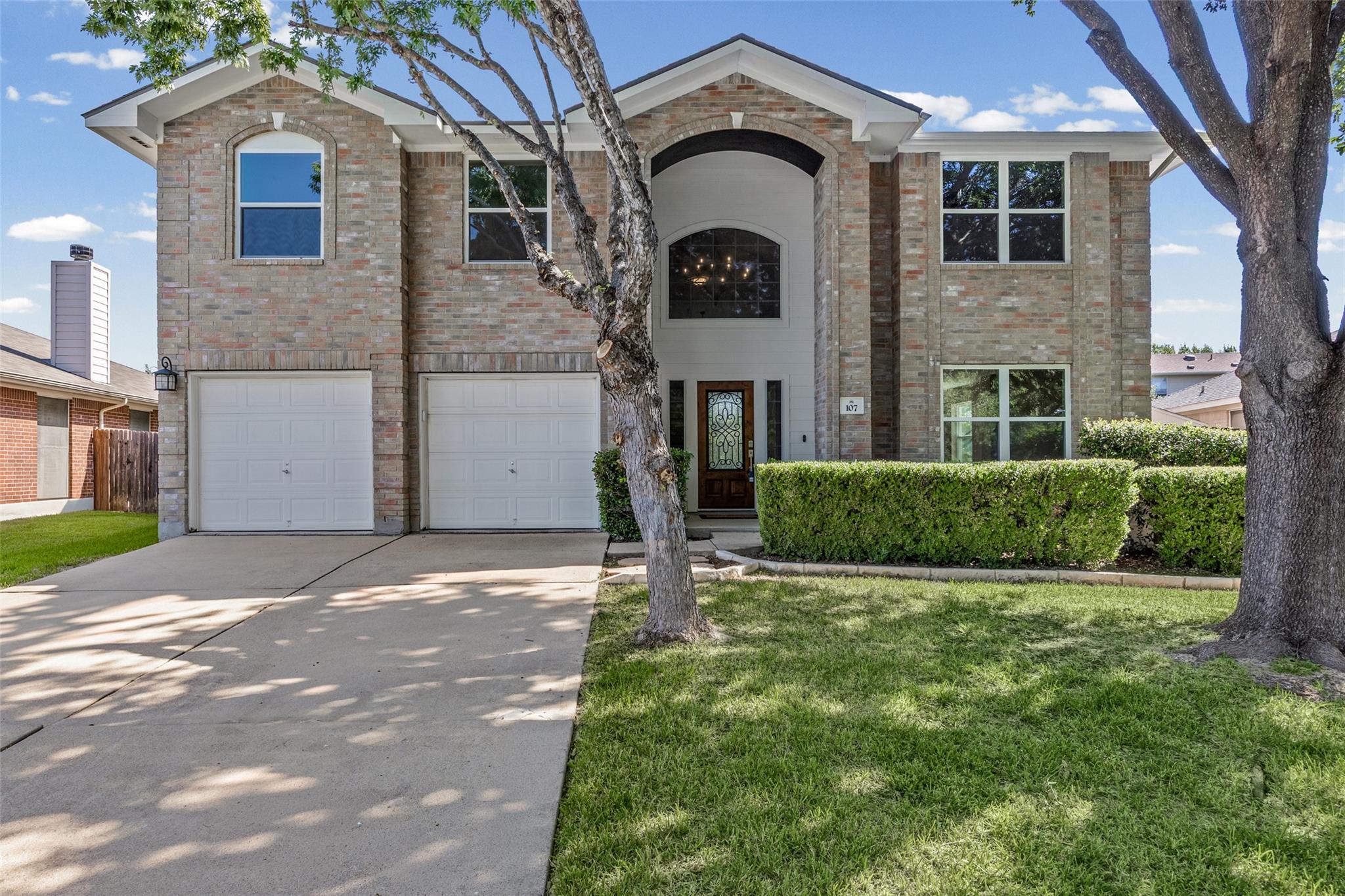 A stately brick facade frames the grand arched en