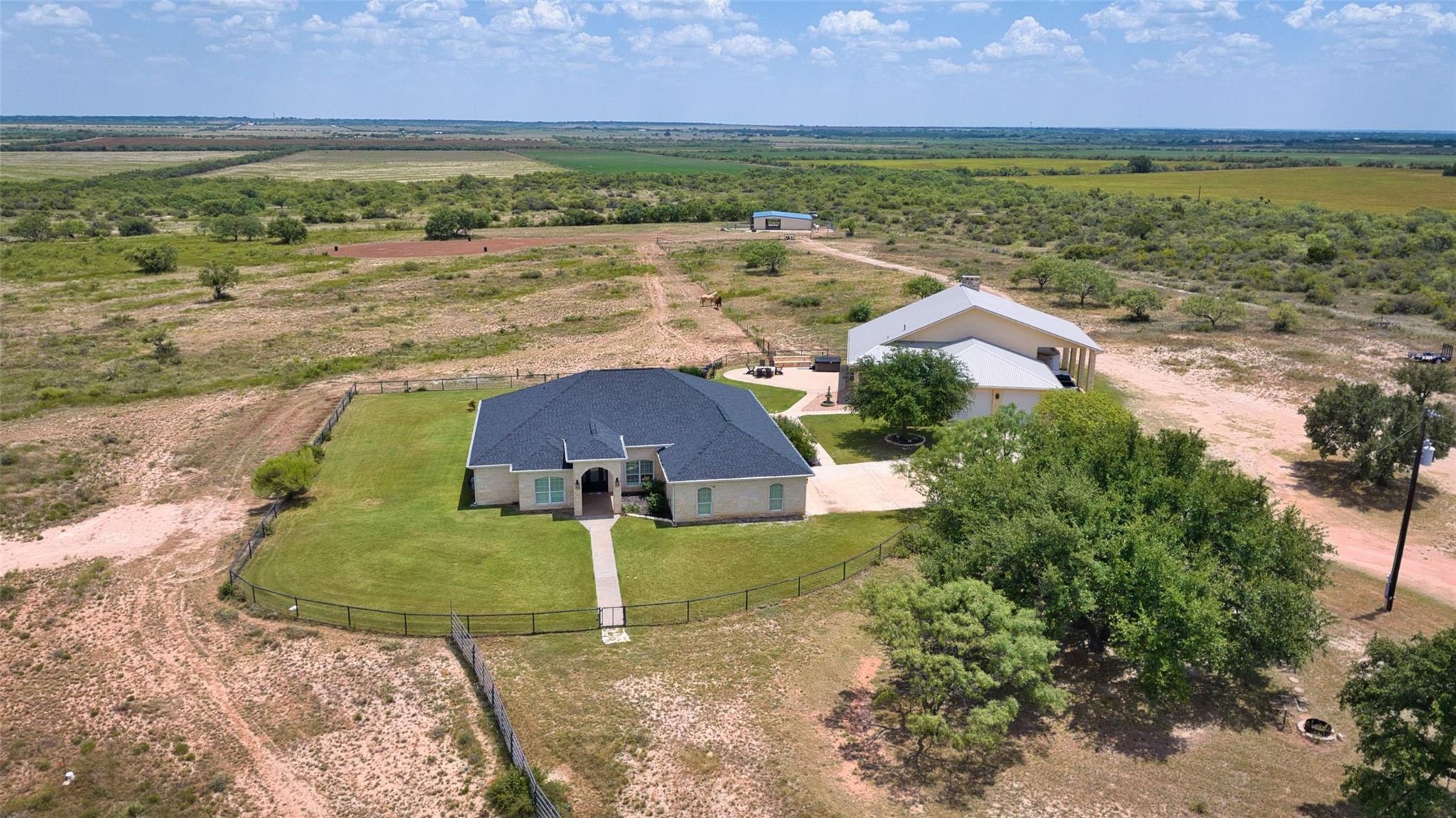 An aerial perspective showcases a sprawling ranch
