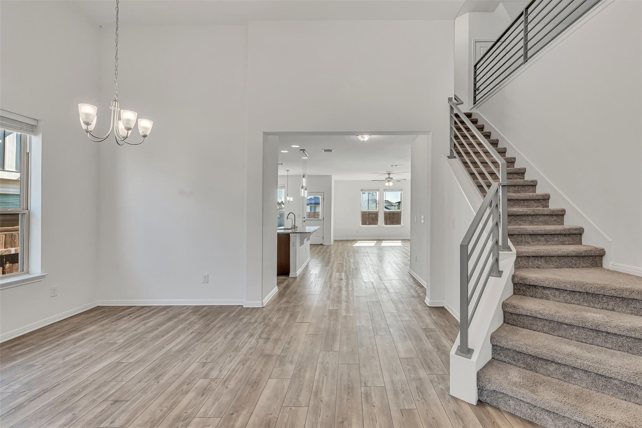 A spacious entry leads to an open-concept living 