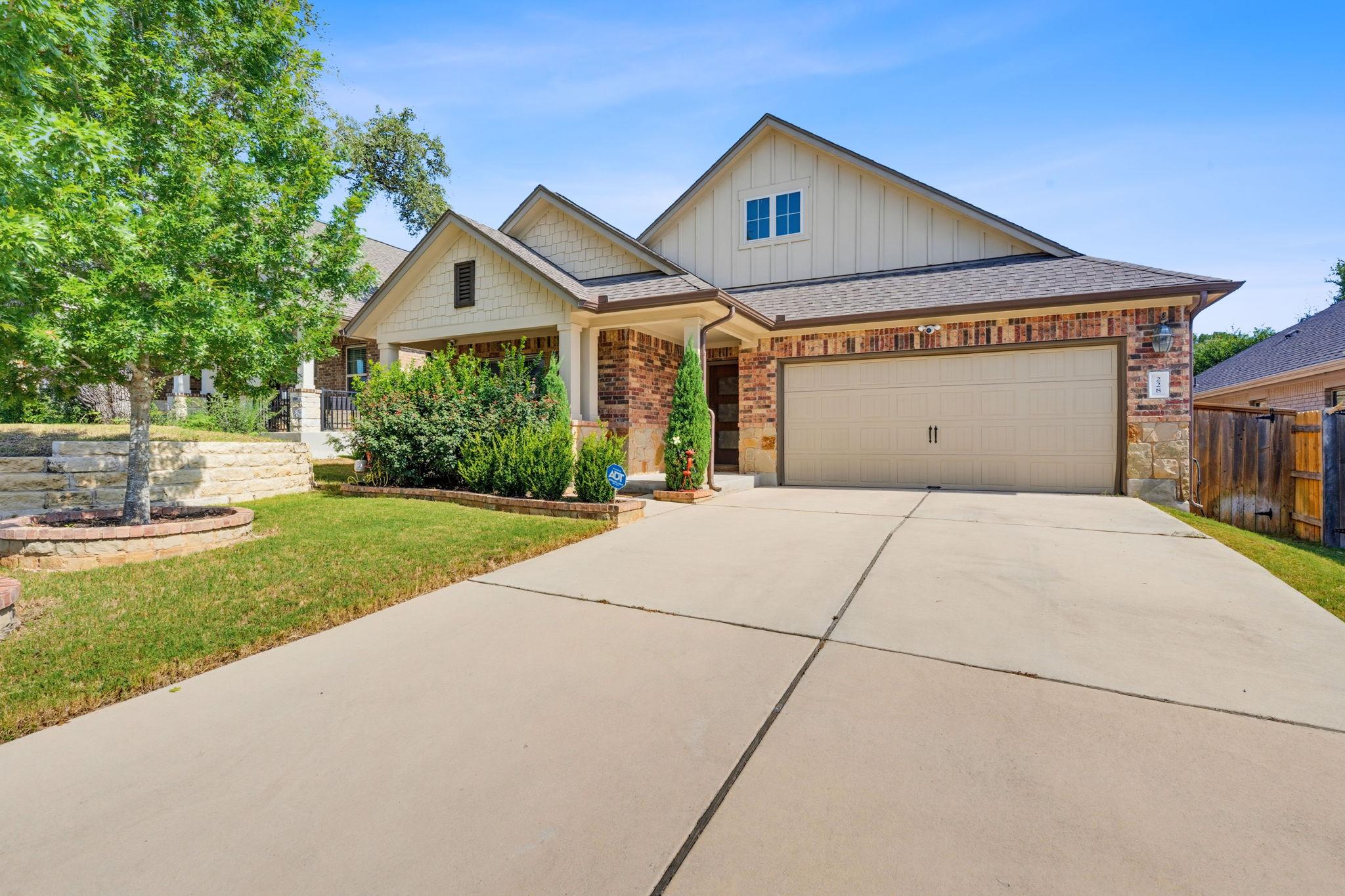 A welcoming front exterior with brick and siding 