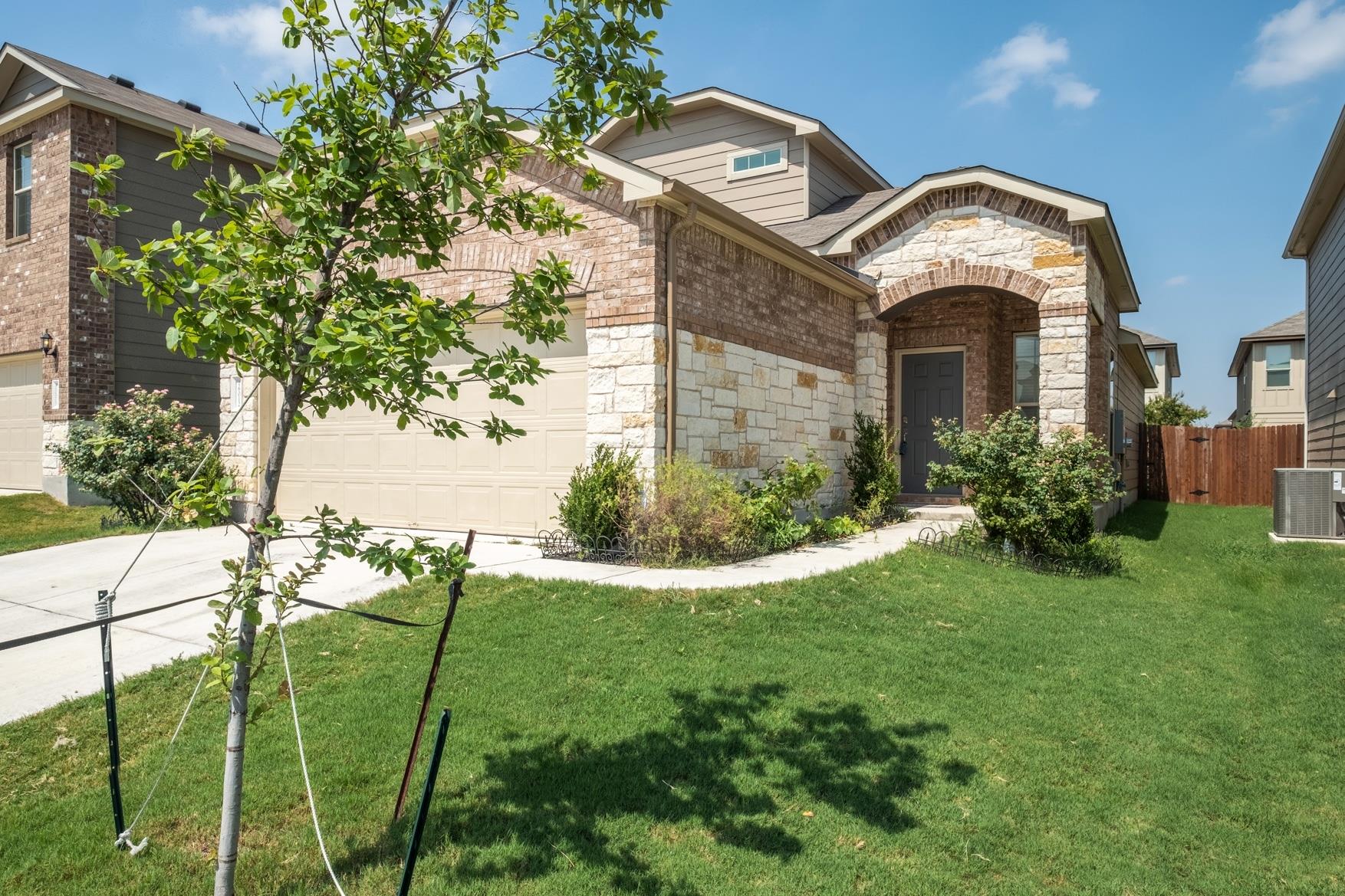 A welcoming stone and brick facade with an arched
