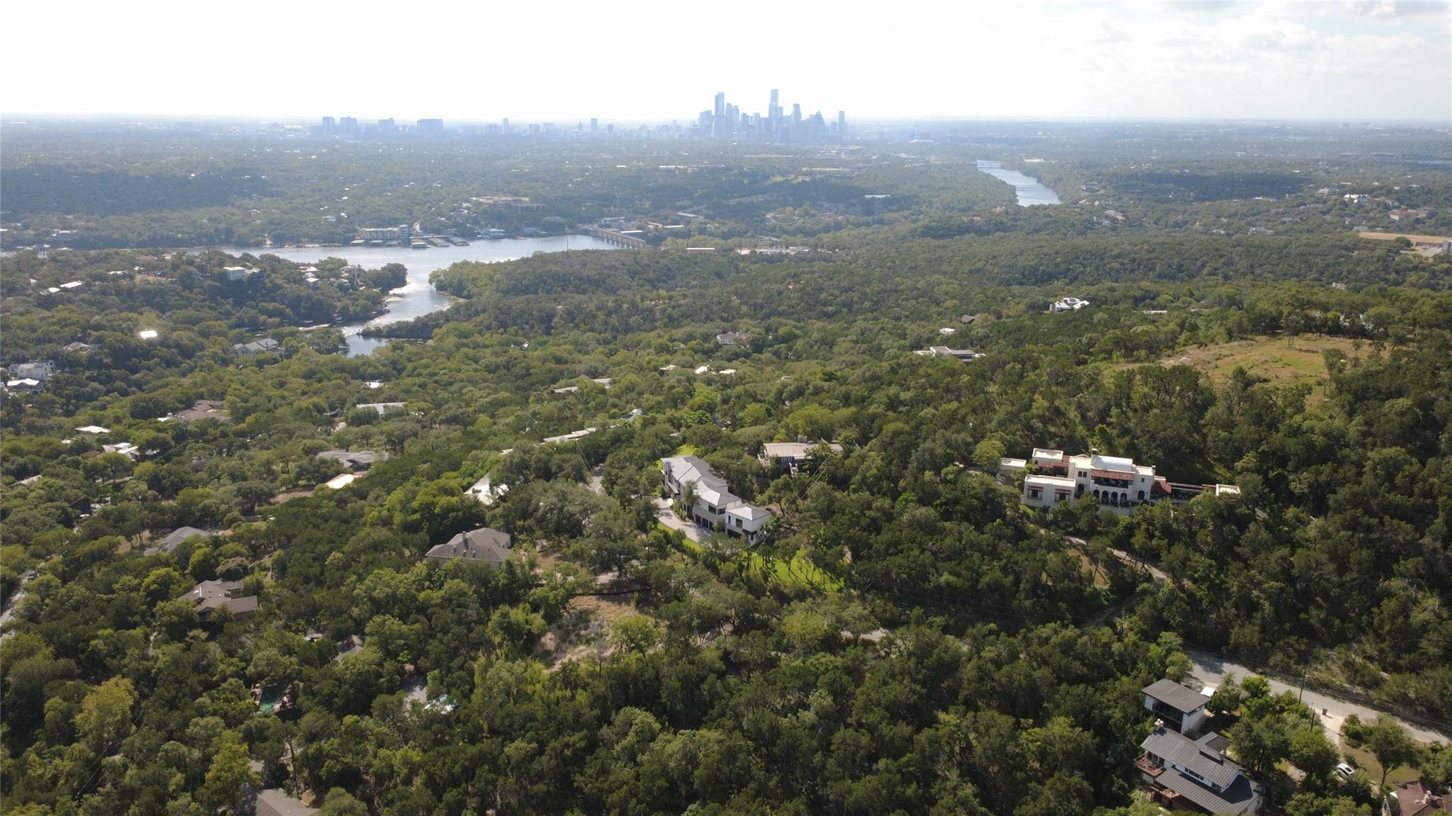 Panoramas of lush rolling hills frame a distant c