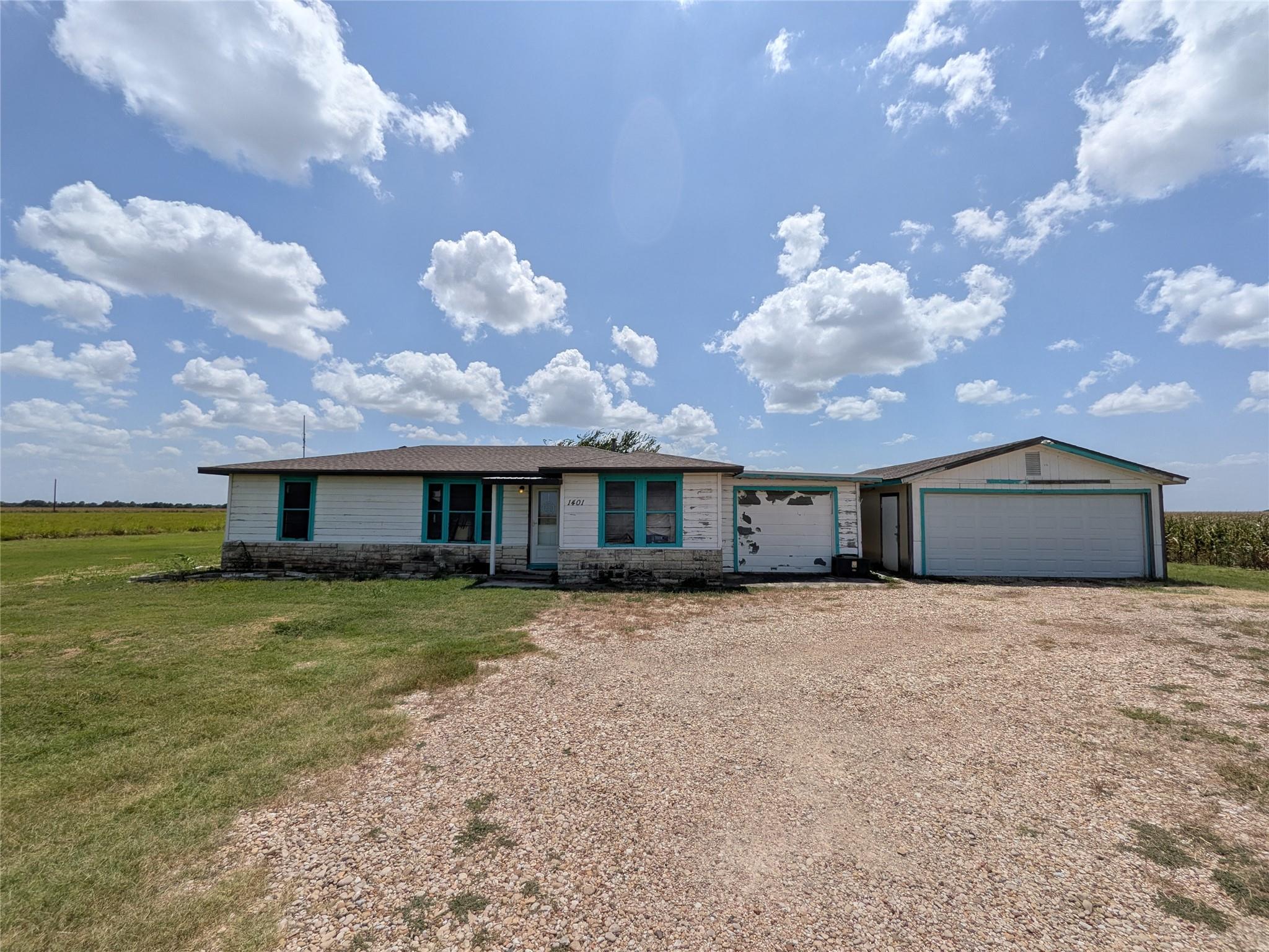 A charming ranch-style home awaits amidst a tranq