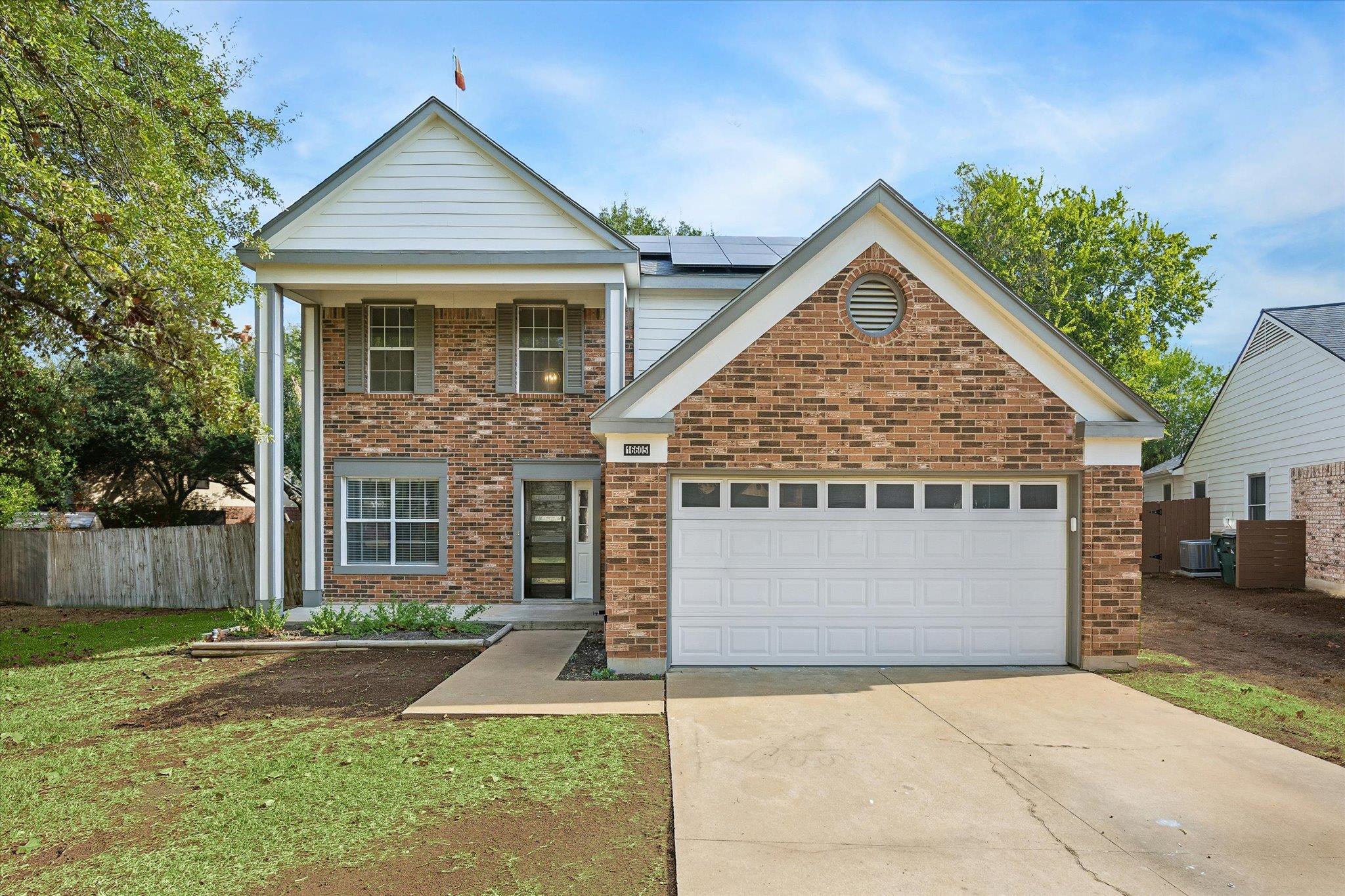 Timeless brick and siding exterior details define