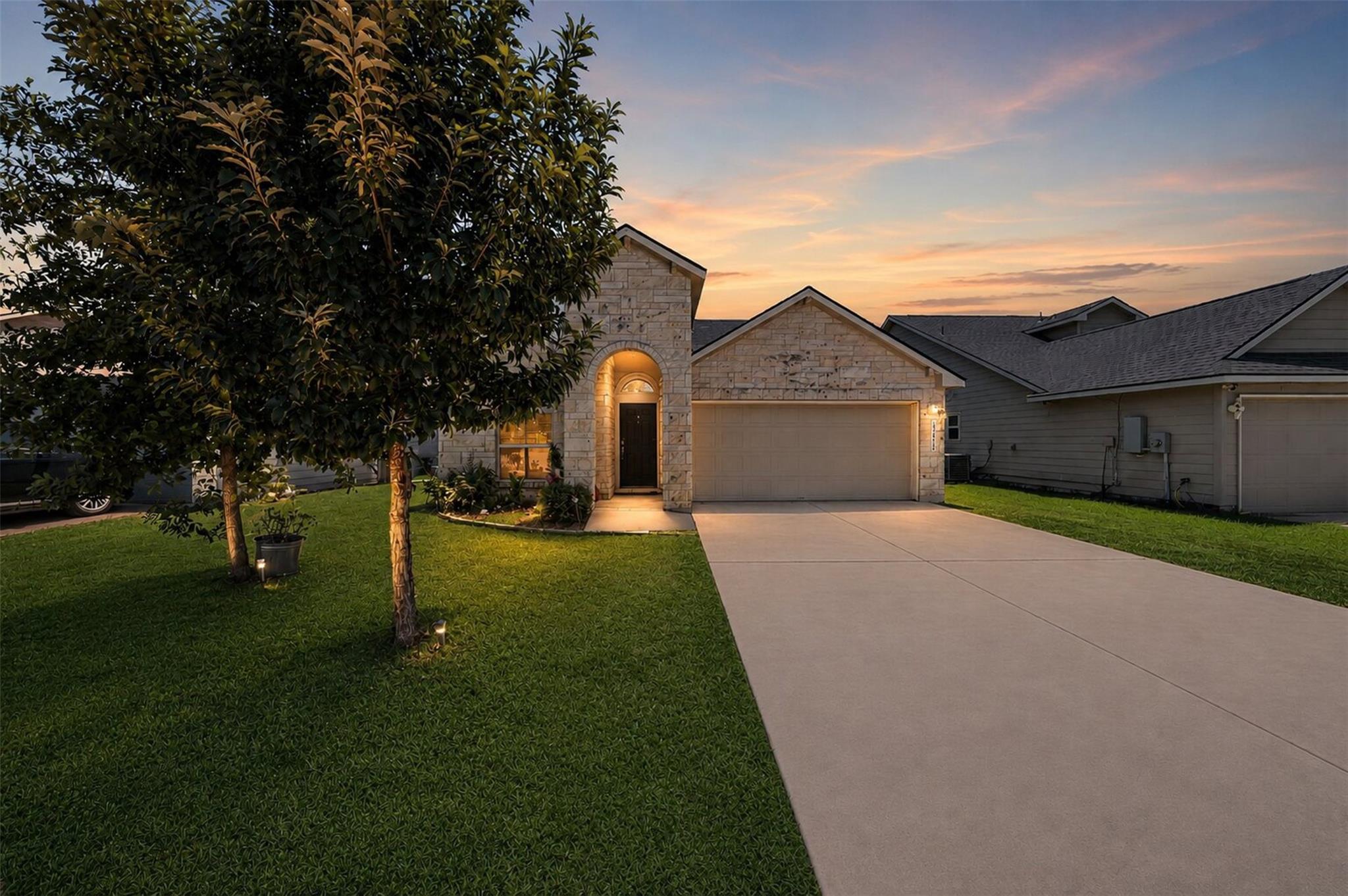 Textured light stone masonry and a wide concrete 