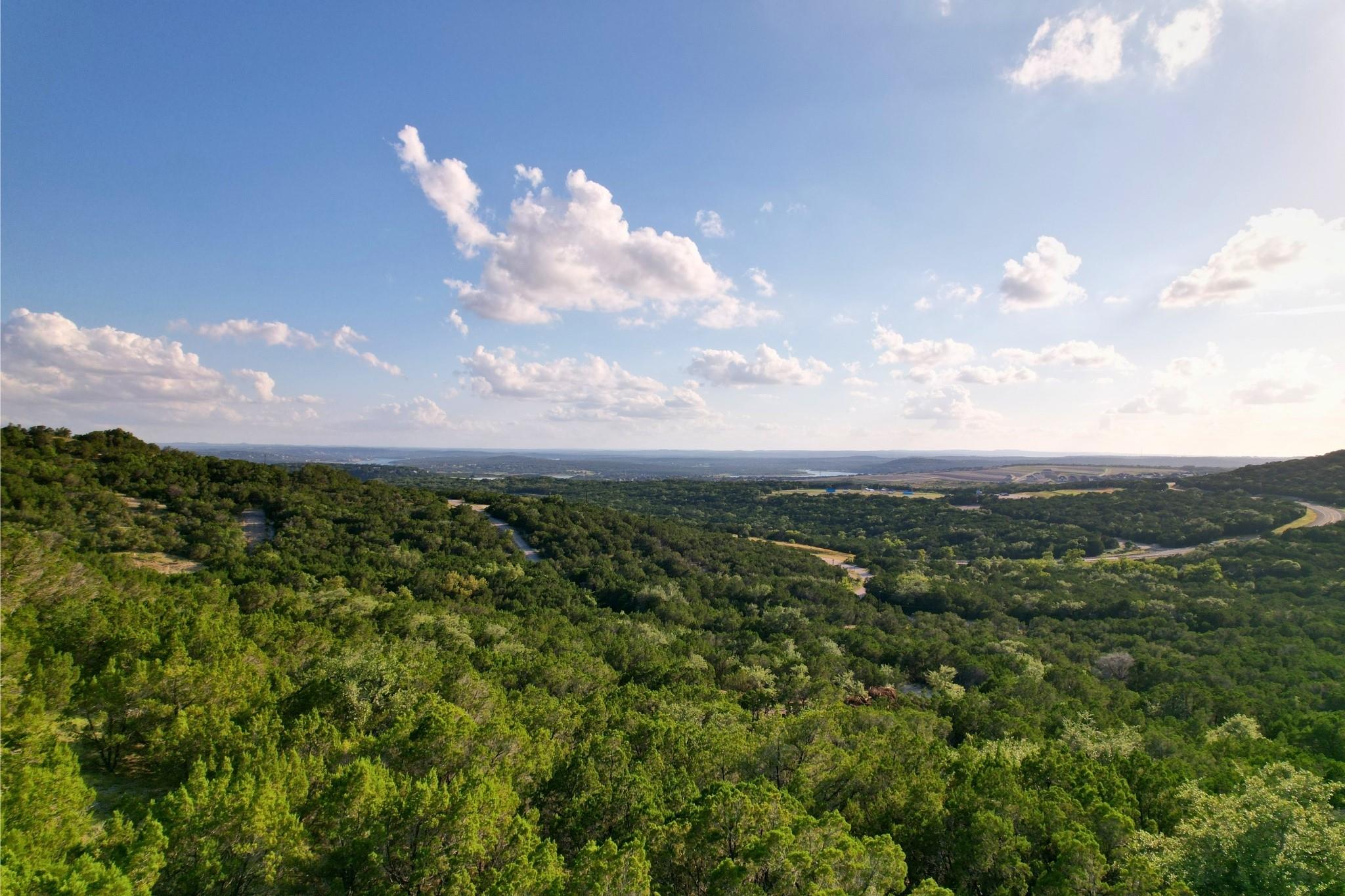 Rolling green hills stretch toward the horizon un