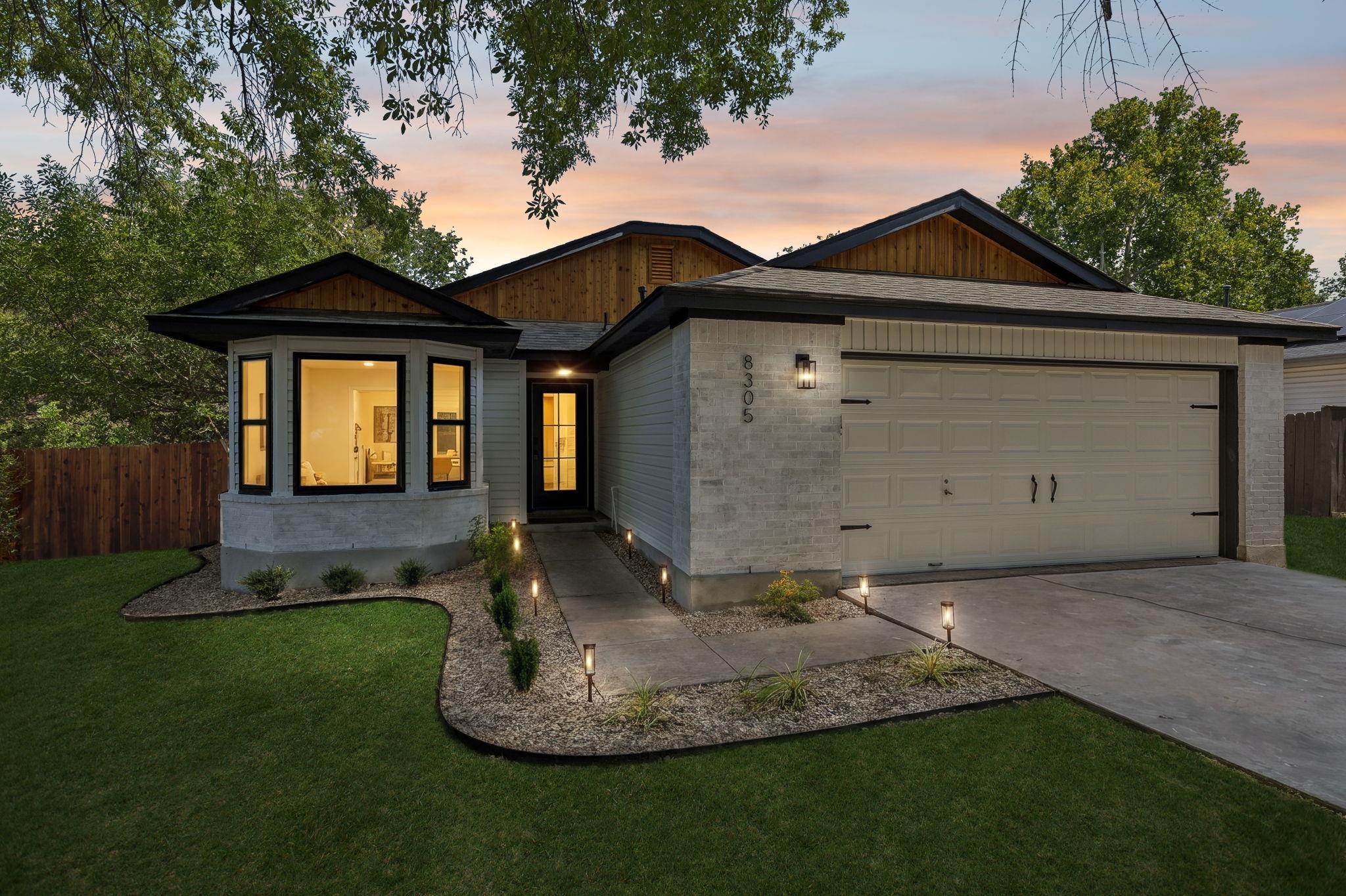 Well-lit exterior showcasing an inviting walkway,