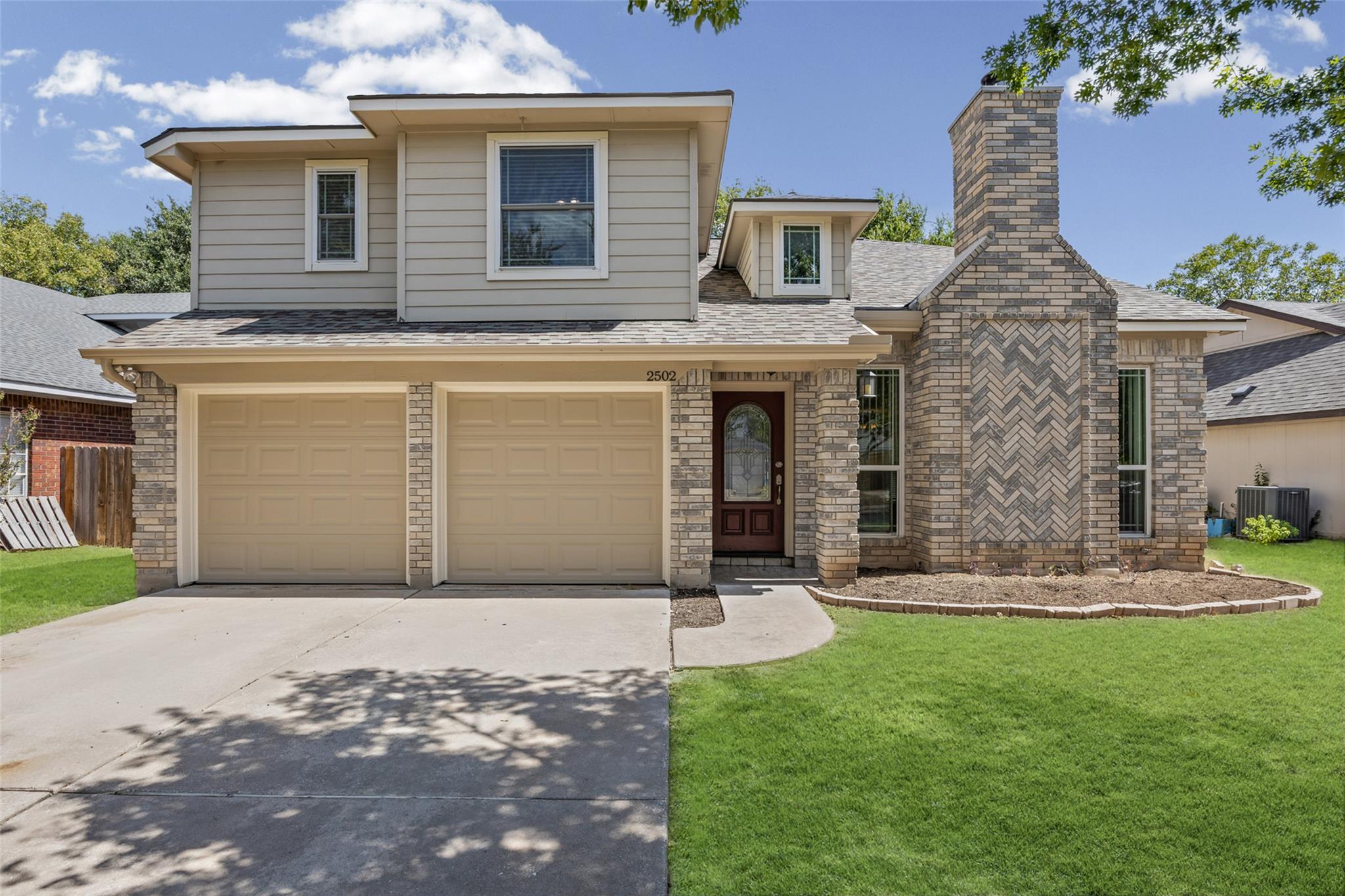 Attractive brick and siding elements create an in