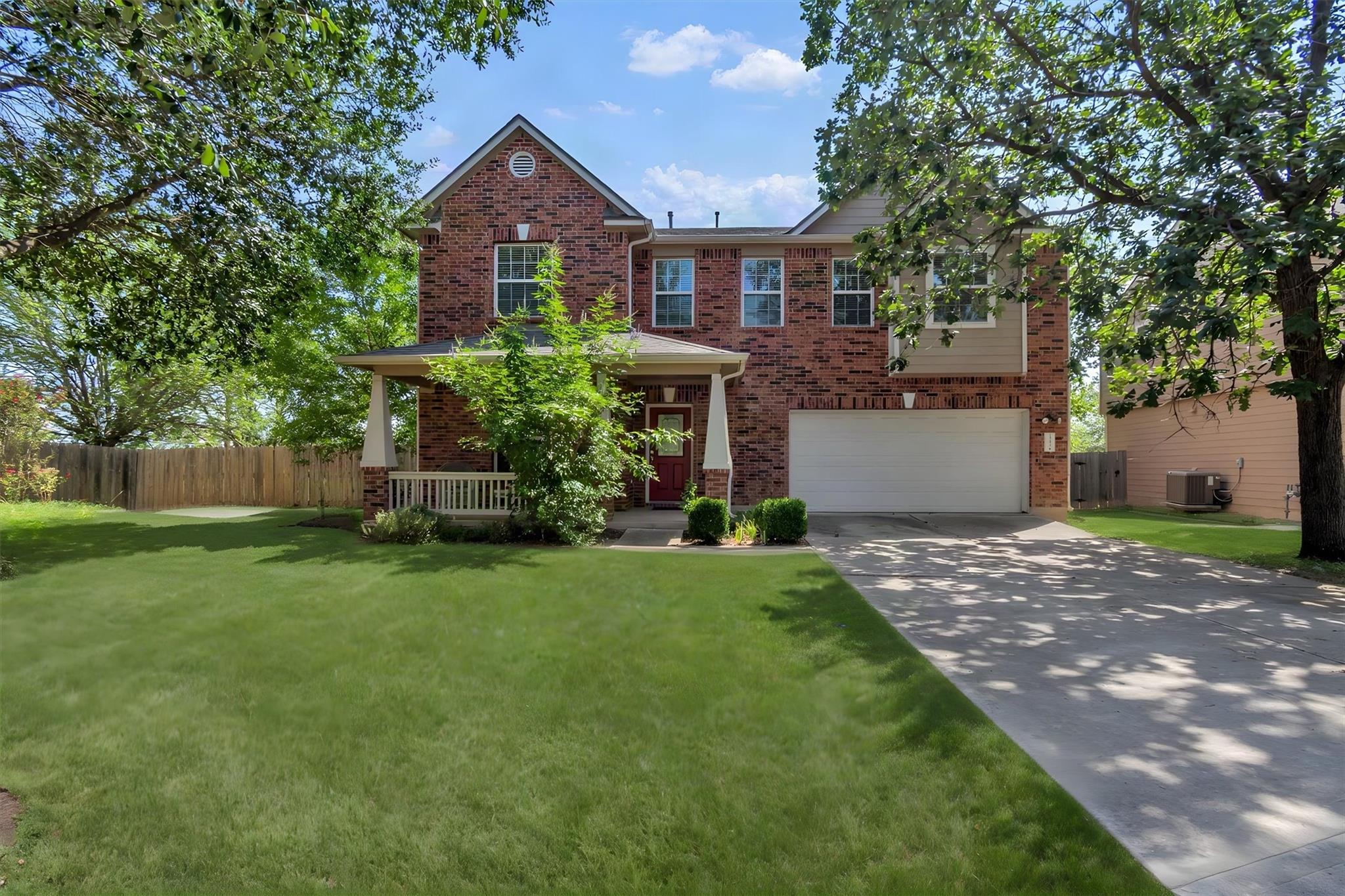Brick facade with a welcoming covered porch, matu