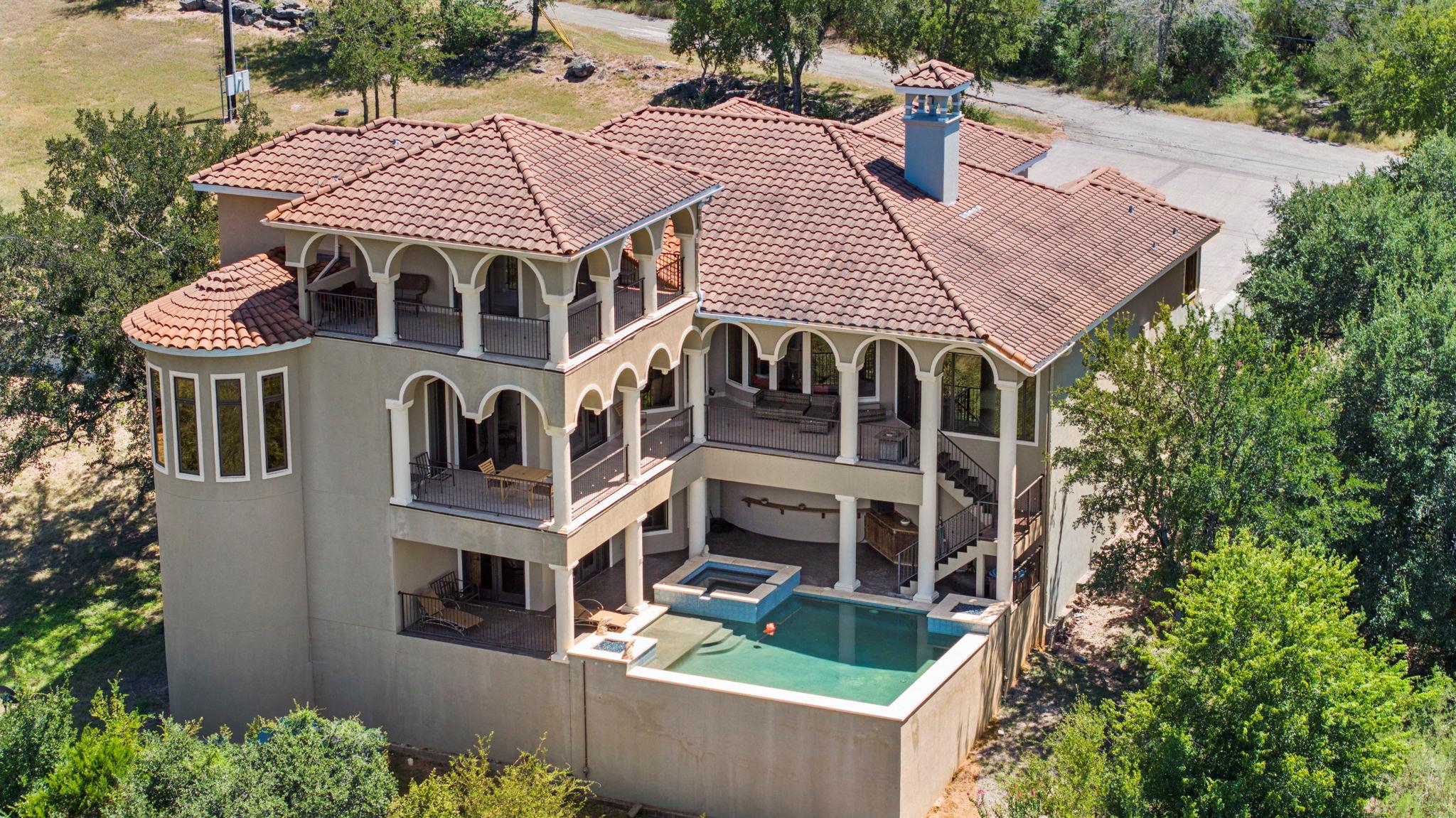 Terraced balconies and a private pool define this