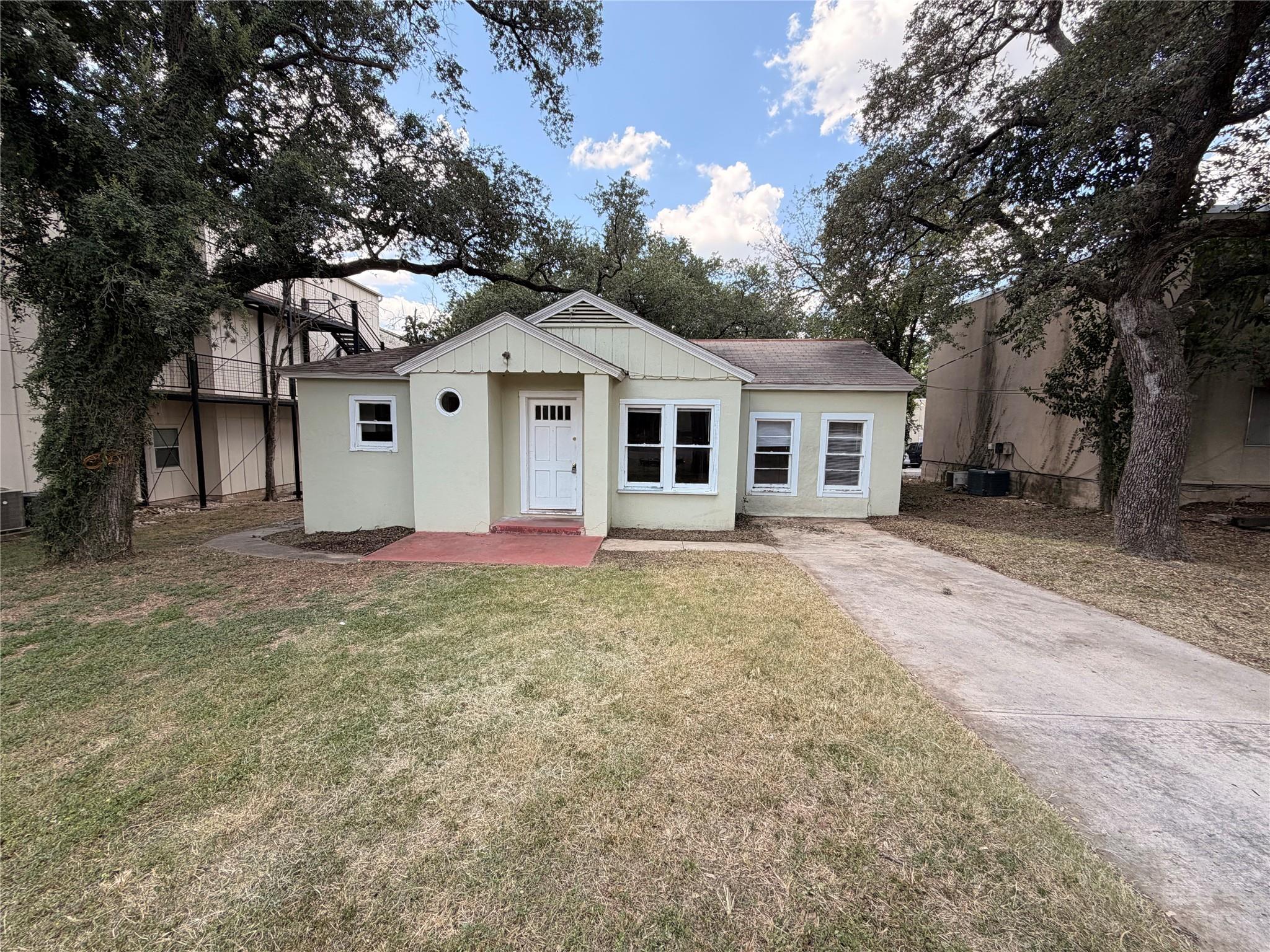 A charming single-story home with a neat front ya
