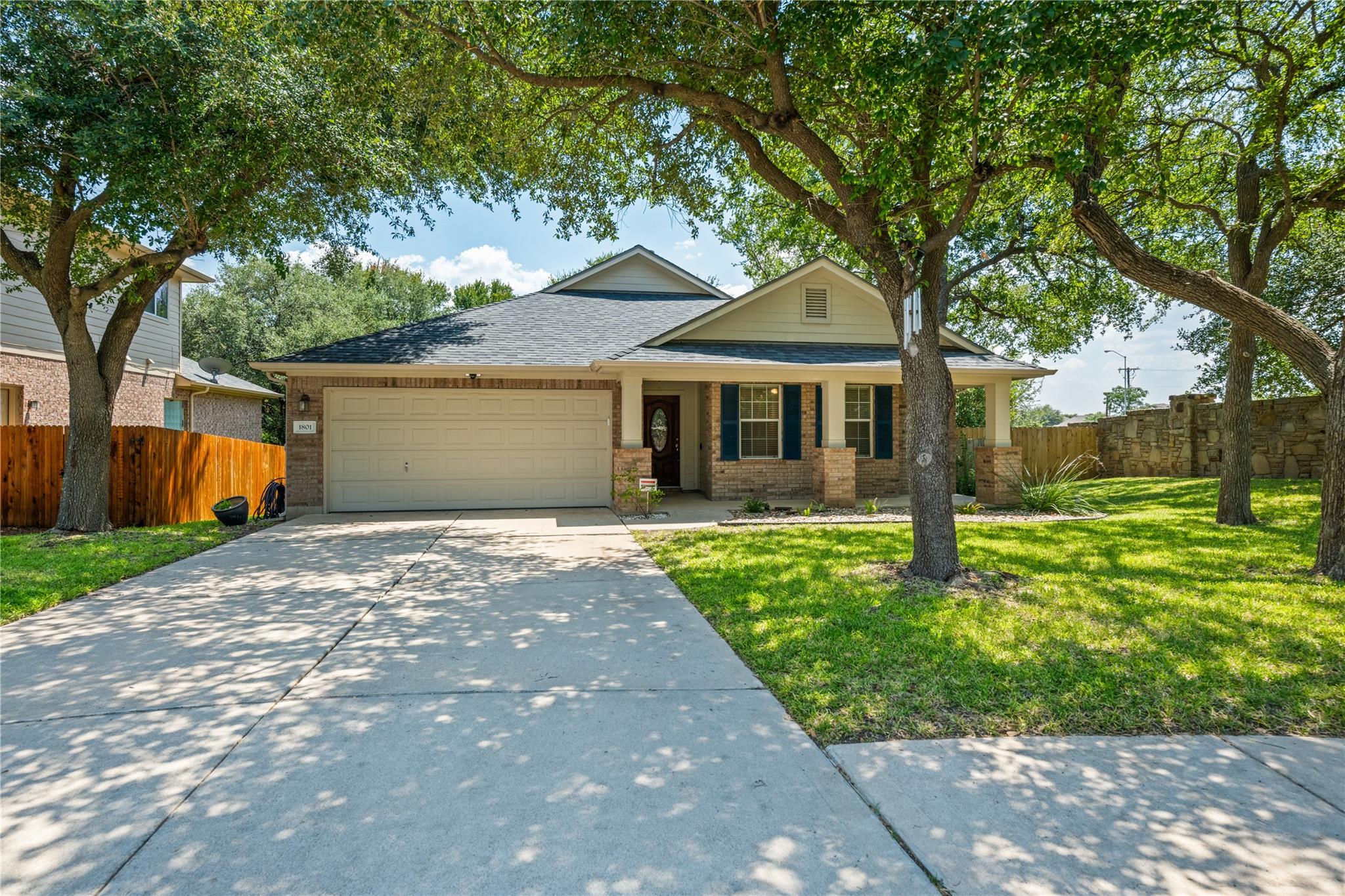 A welcoming brick facade with a covered porch and
