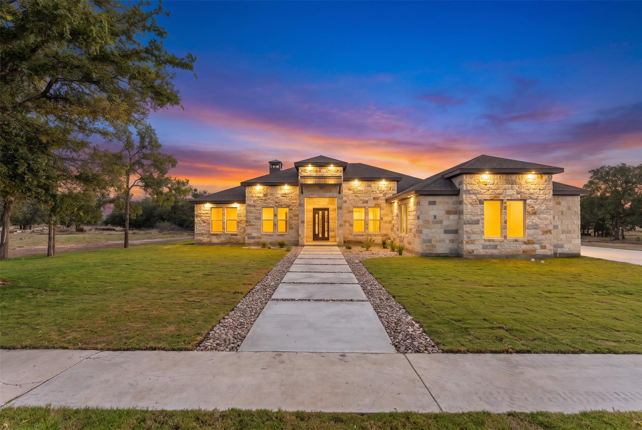 Stone-clad facade with an inviting entryway welco