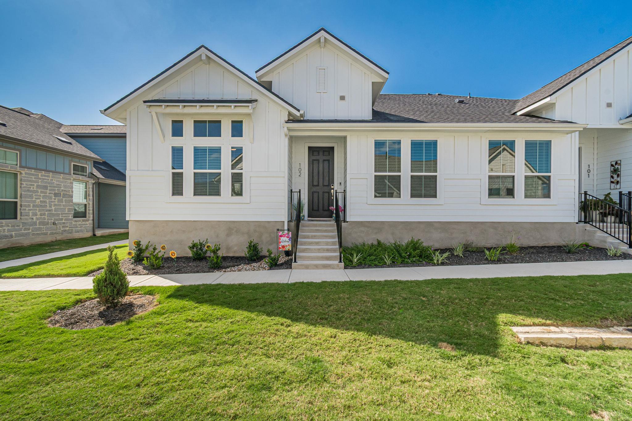 A well-maintained lawn welcomes you to this prist