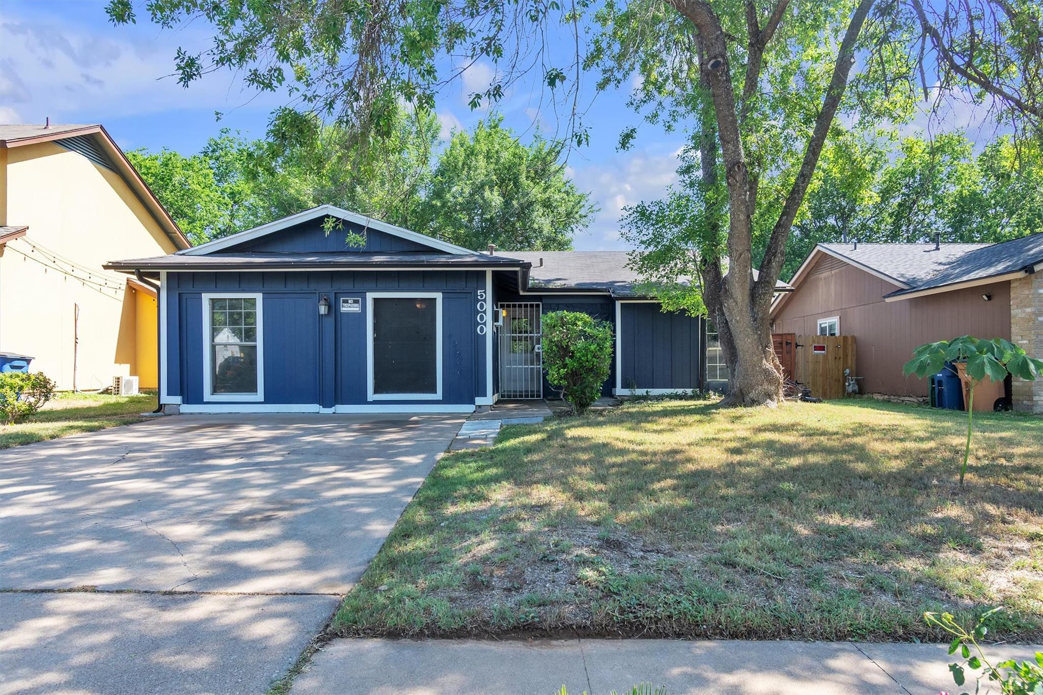 A deep blue exterior with crisp white trim create