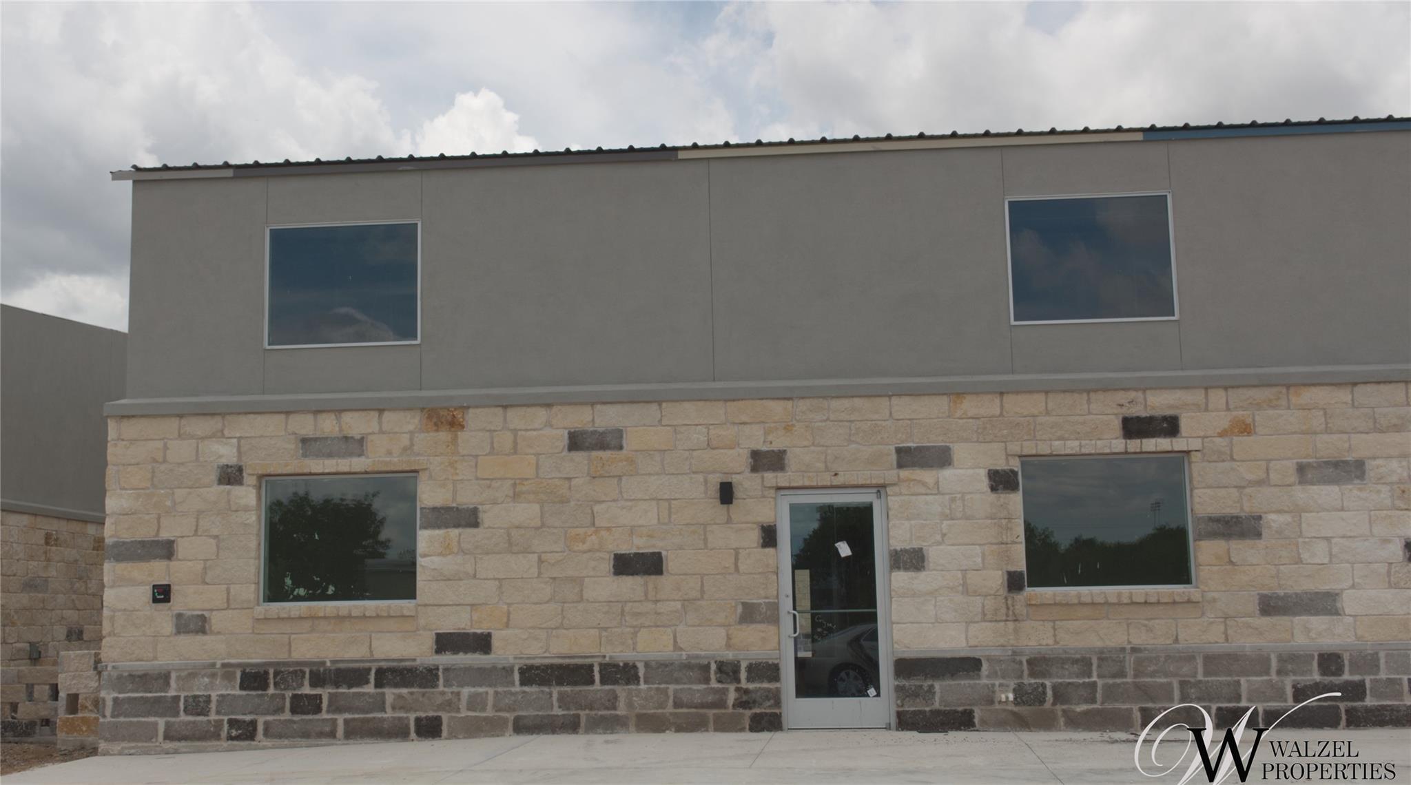 A commercial façade featuring a blend of natural 