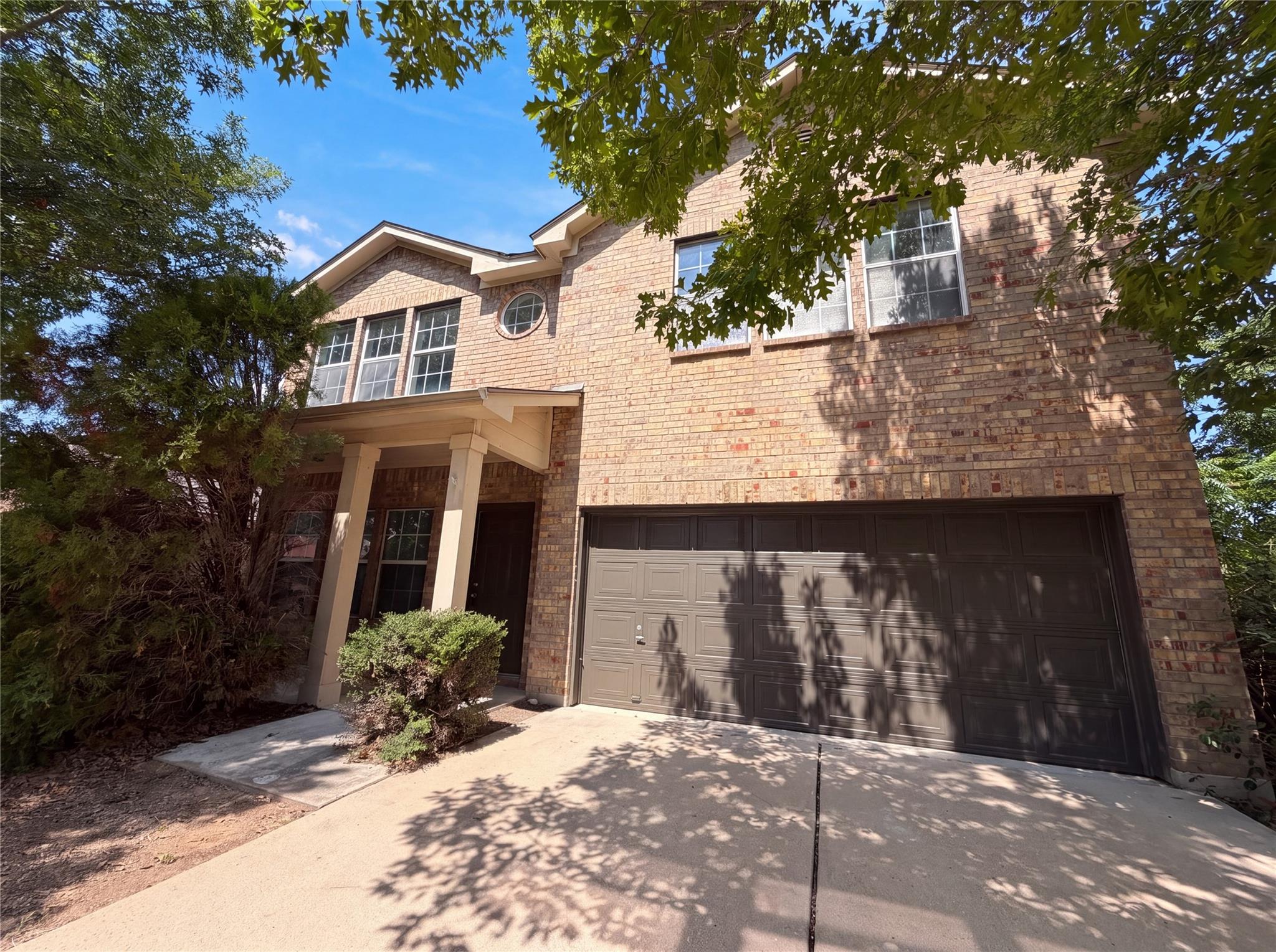 A classic brick facade welcomes with a charming c