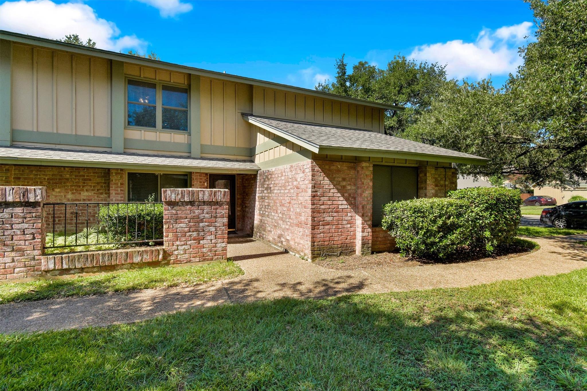 A classic brick exterior with a well-maintained l