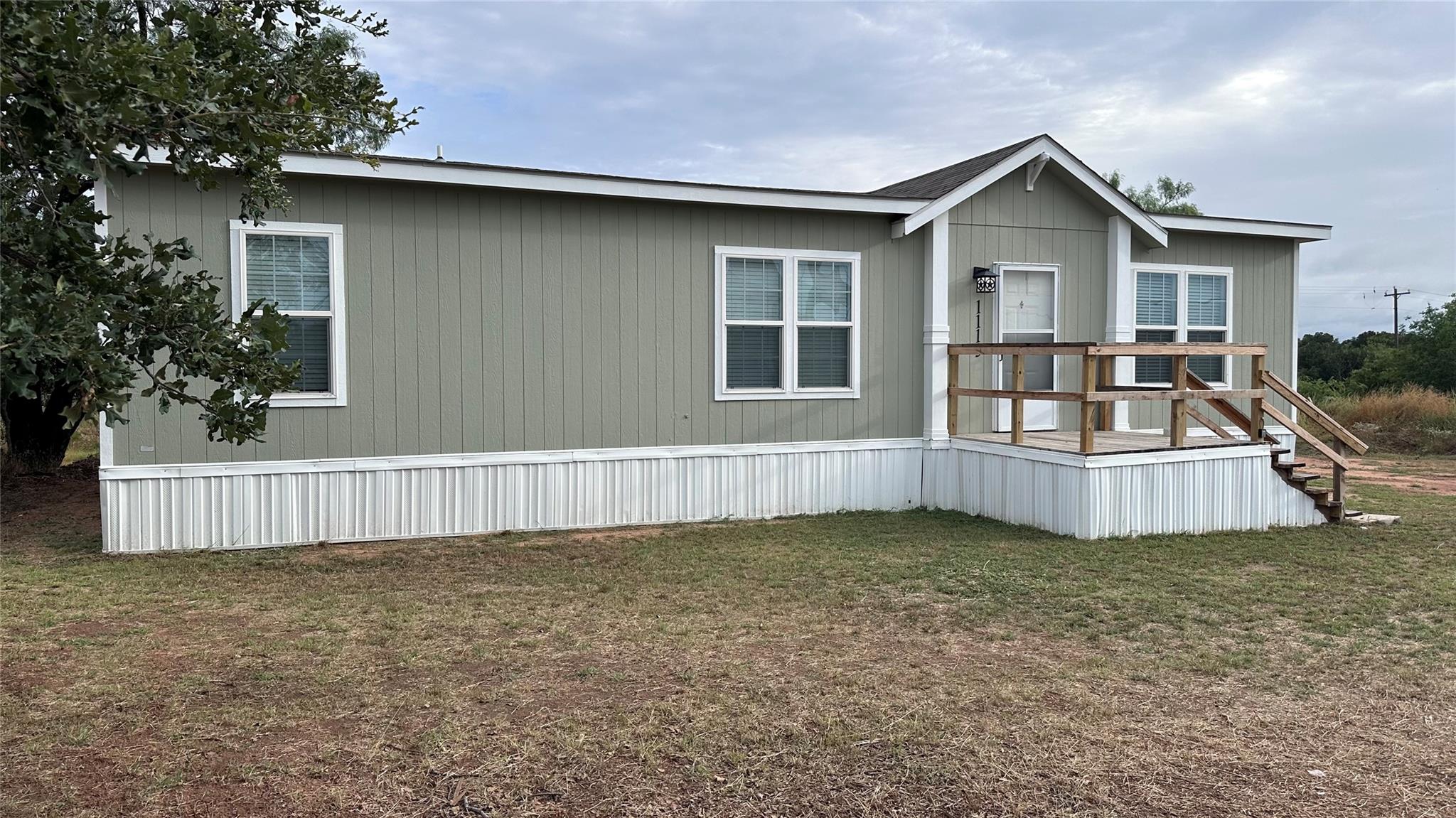A welcoming front porch and practical steps defin